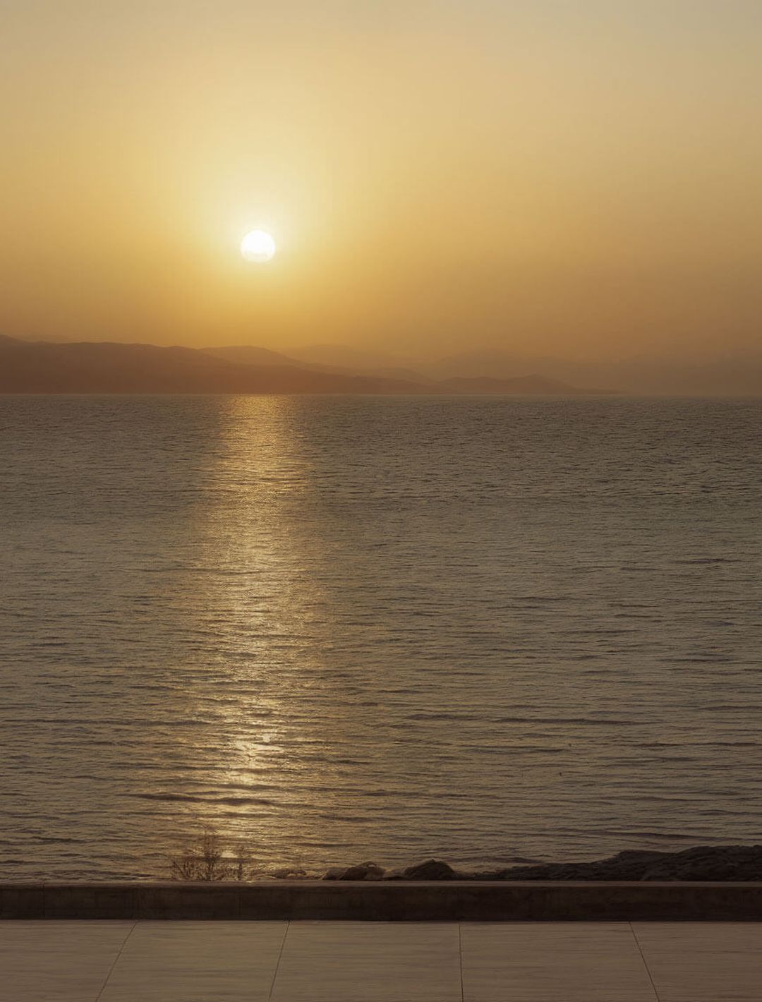 Sunset on shoreline in Greece