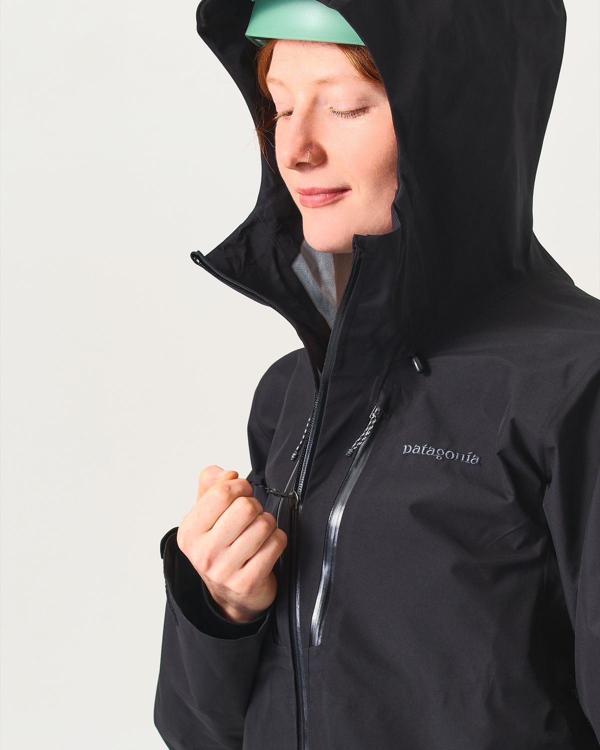 Adjustable helmet compatible hood