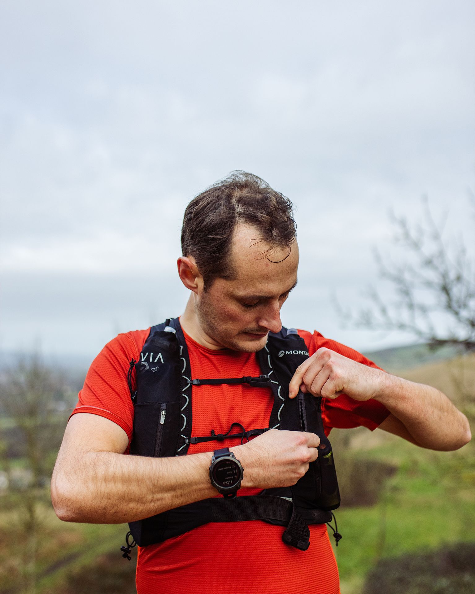 Trail runner wearing a running vest
