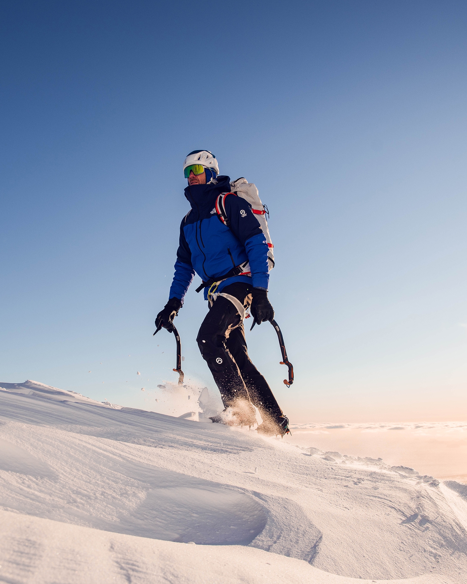 Ice climber wearing The North Face Clothing