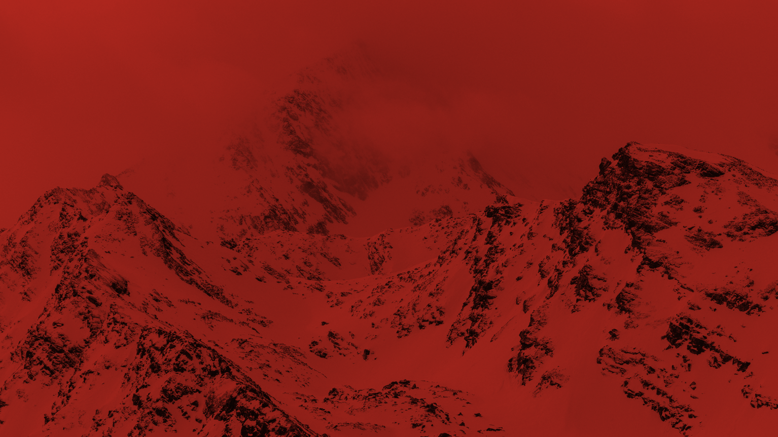 Dramatic red-tinted snowy mountain range with jagged peaks and faint mist, conveying a powerful and intense atmosphere.