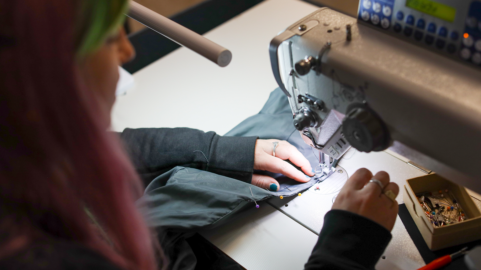 person repairing jacket