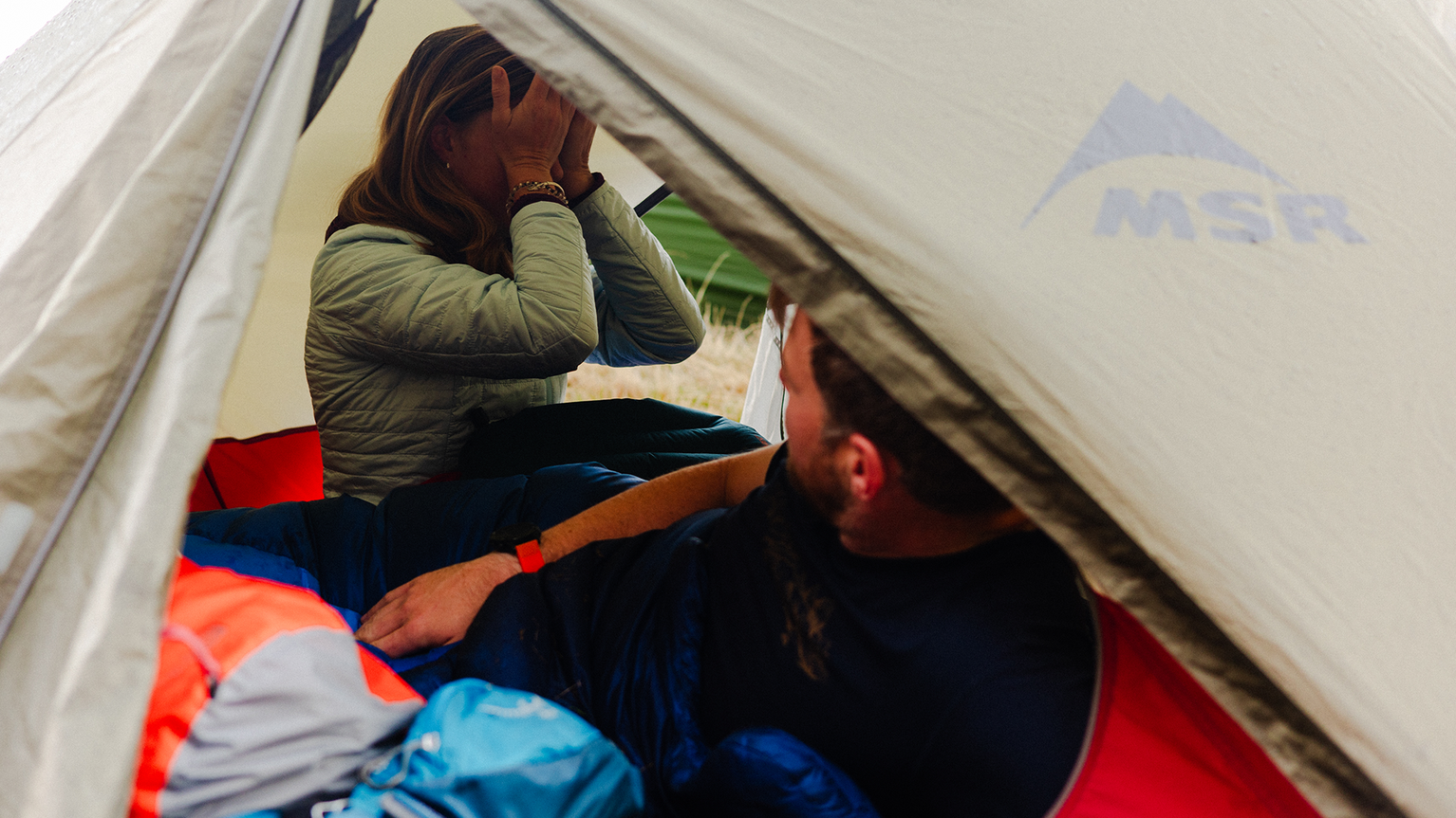 two people in a tent