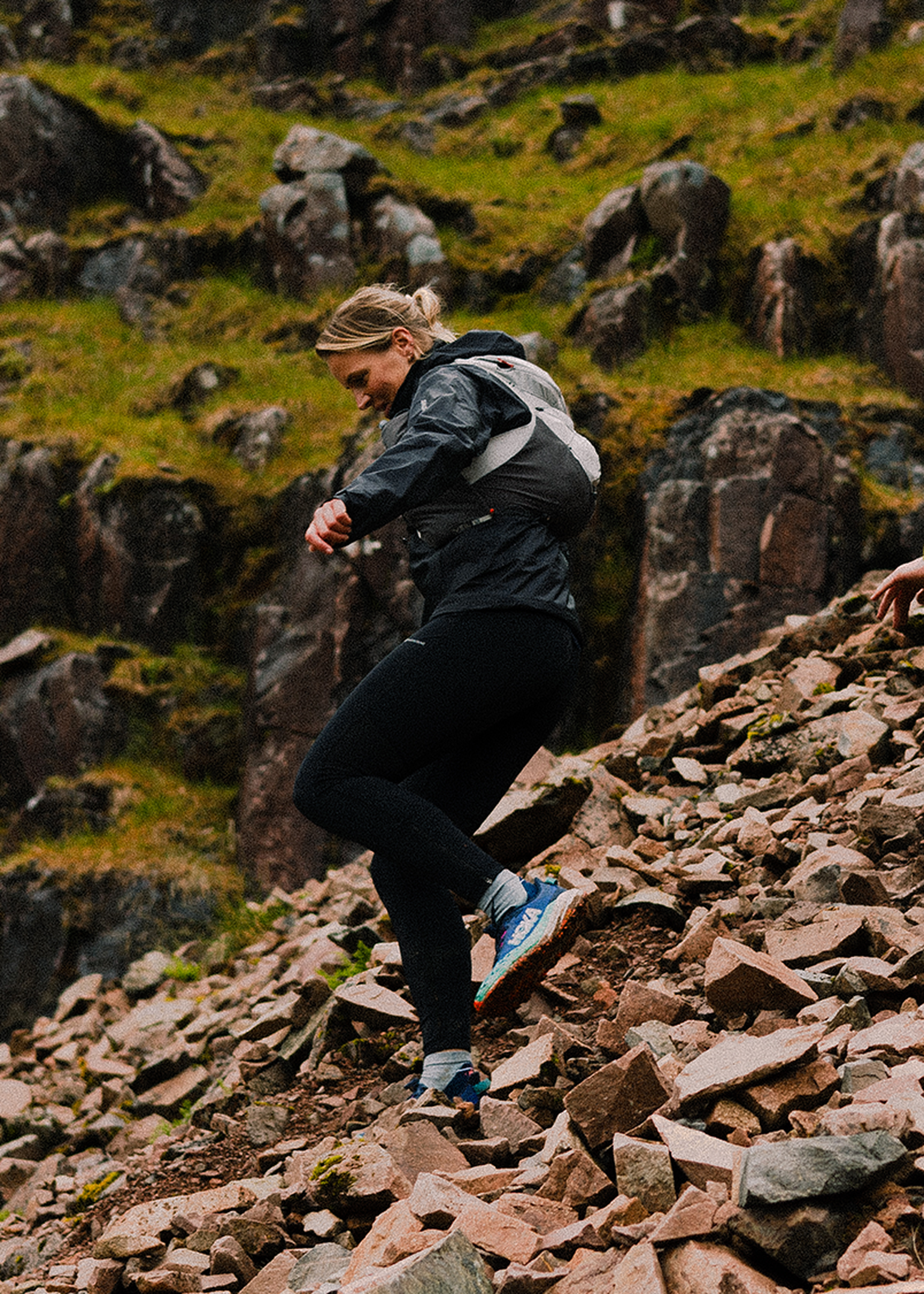 two trail runners running downhill