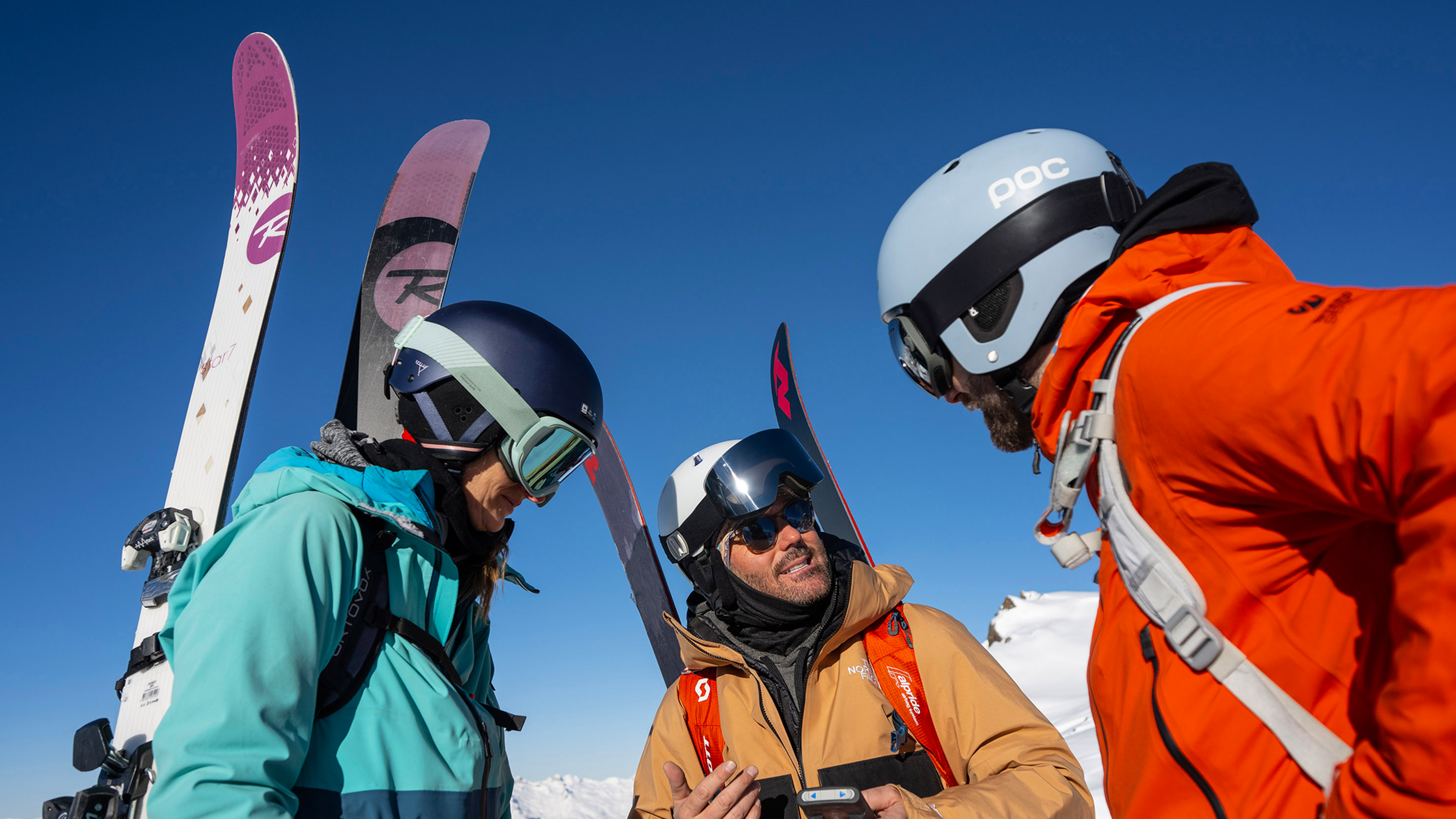 three off piste skiiers
