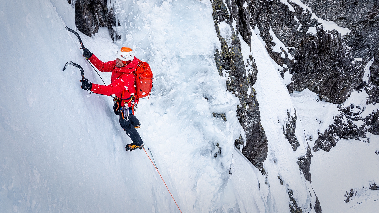 man ice climbing