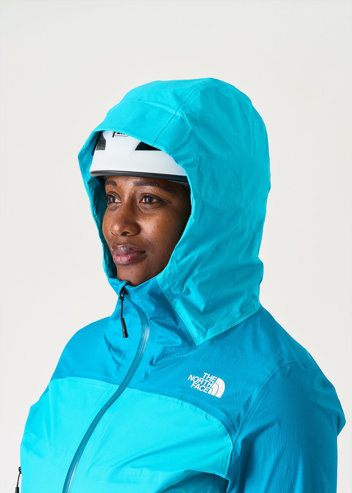 Adjustable helmet compatible hood