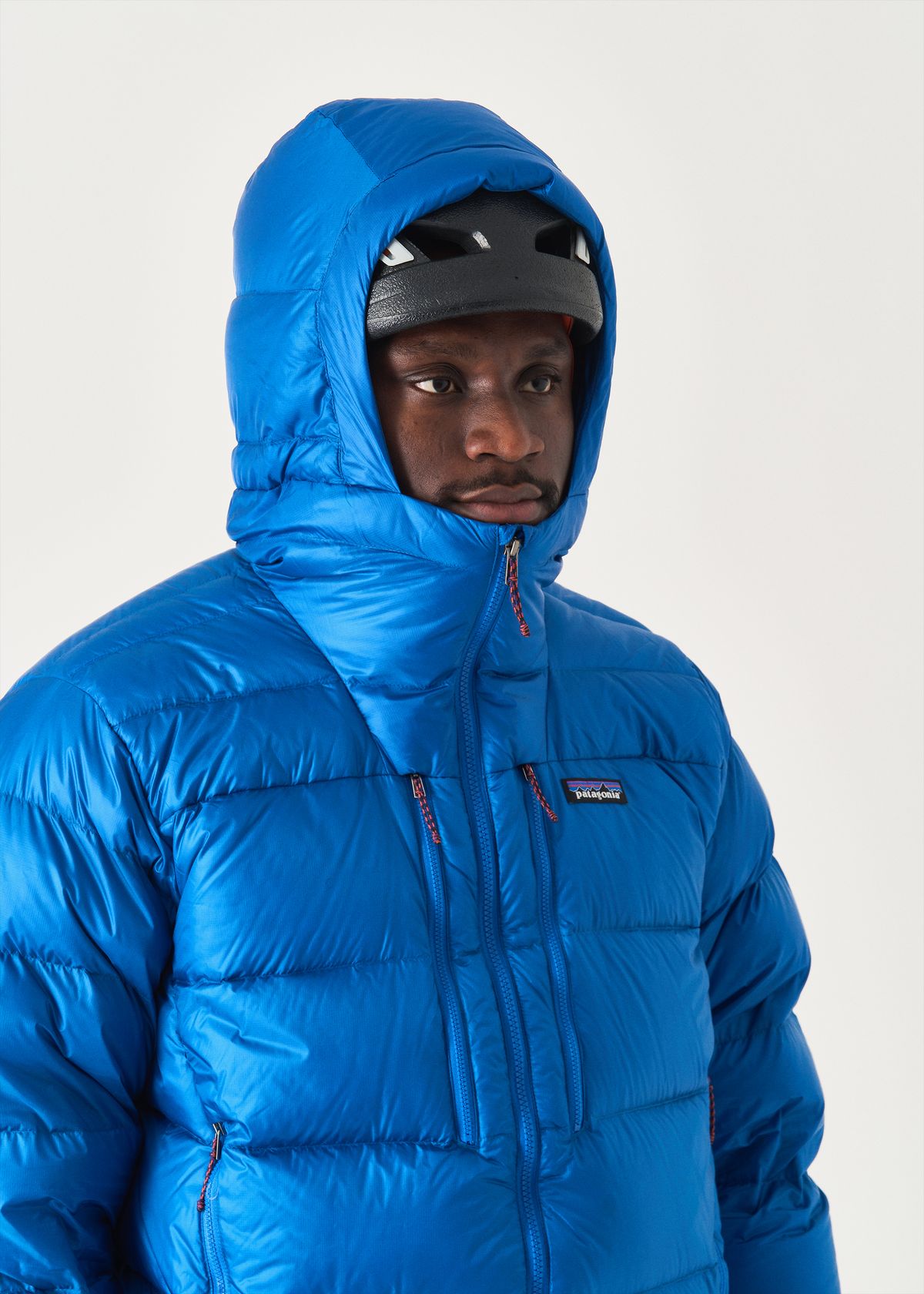  Adjustable helmet-compatible hood