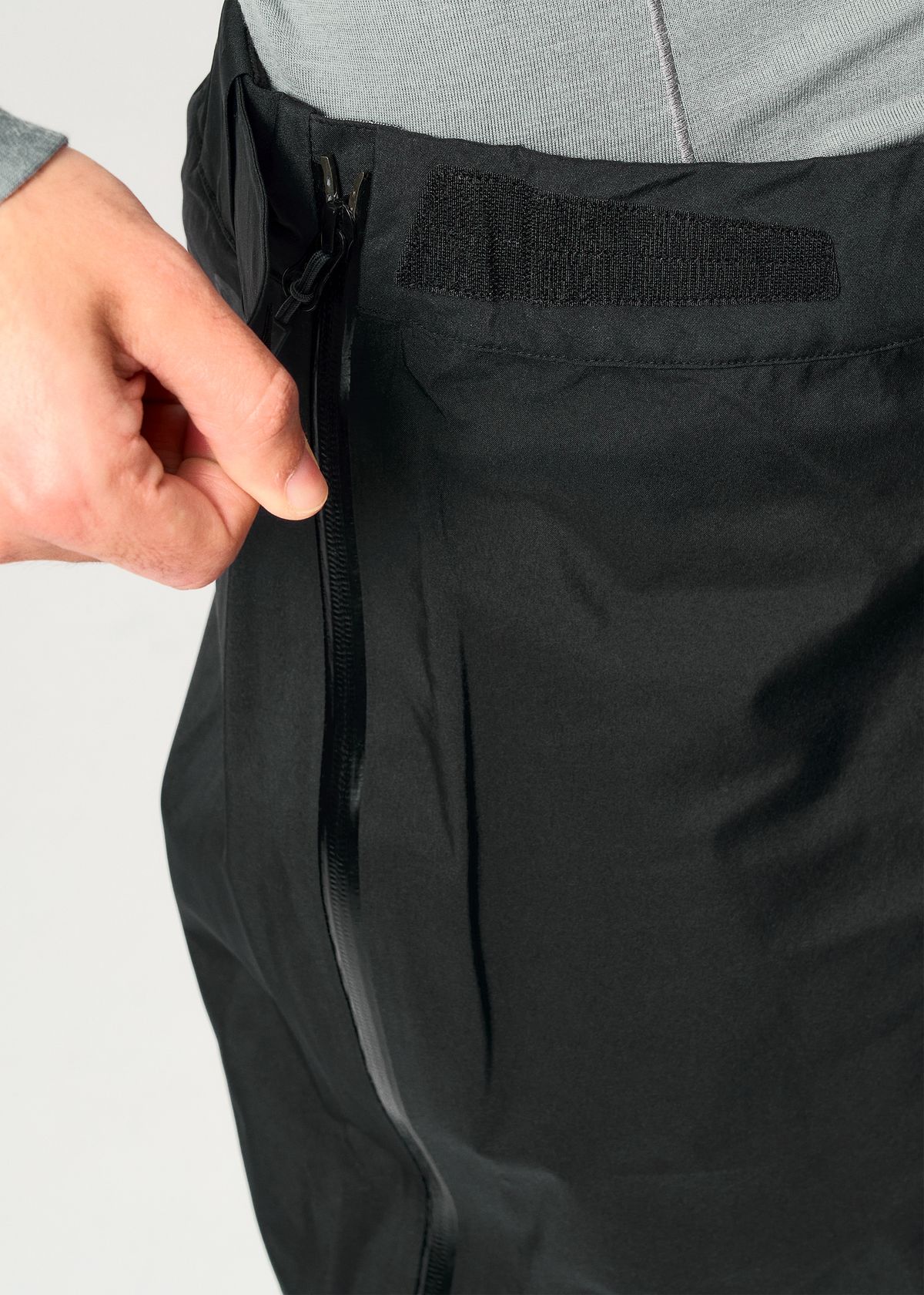 Elasticated waistband with tab adjustments