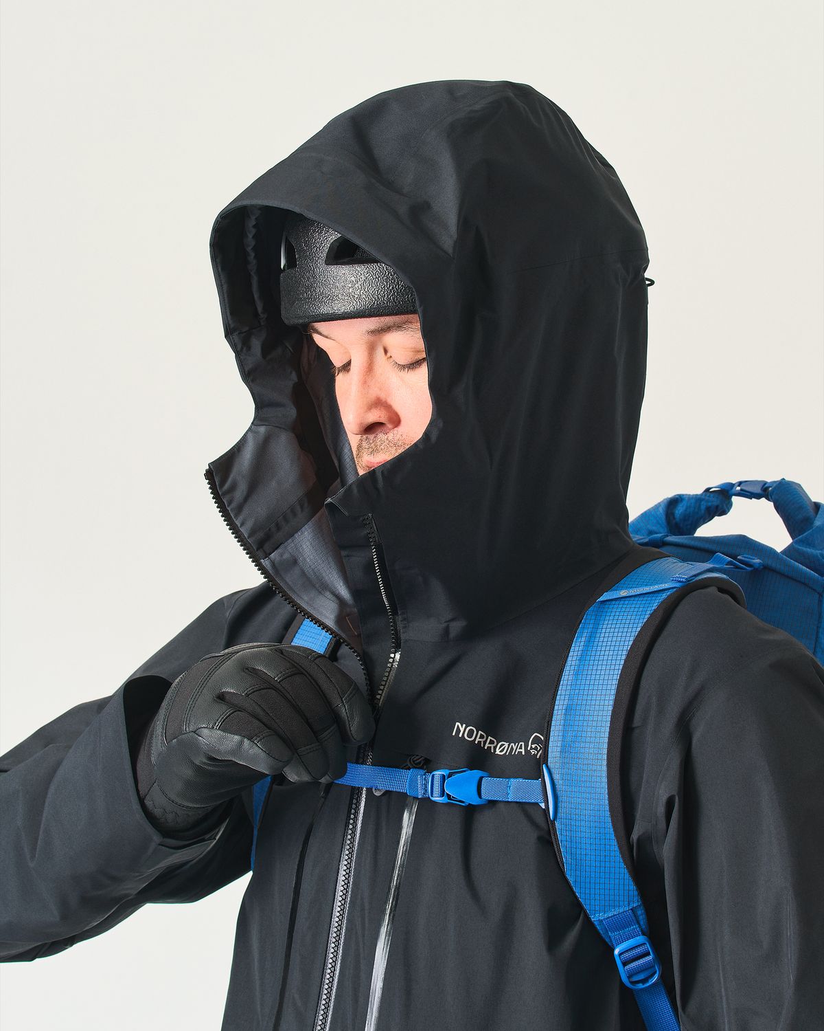 Adjustable helmet compatible hood