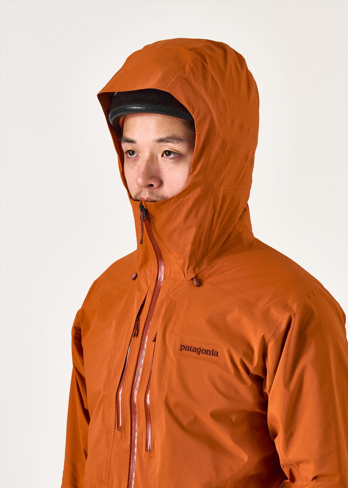 Adjustable helmet compatible hood