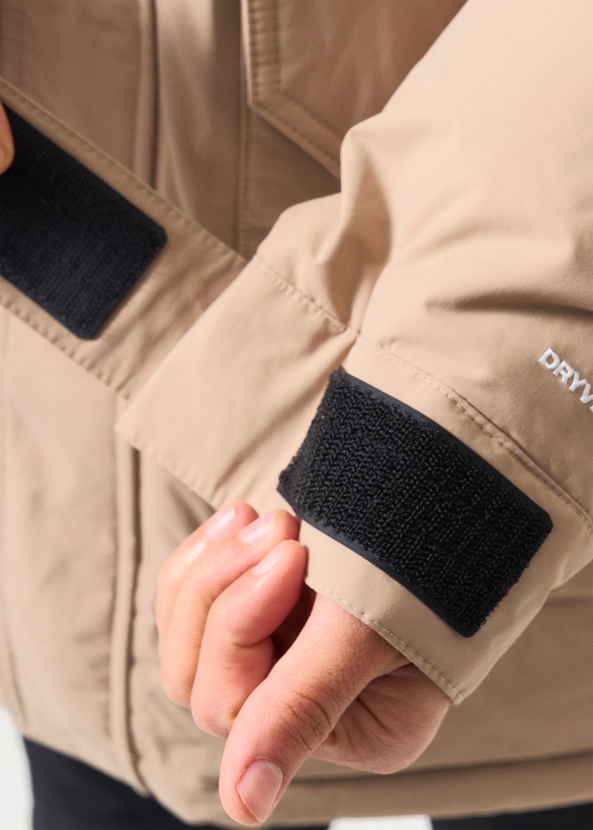 Adjustable hook-and-loop cuffs