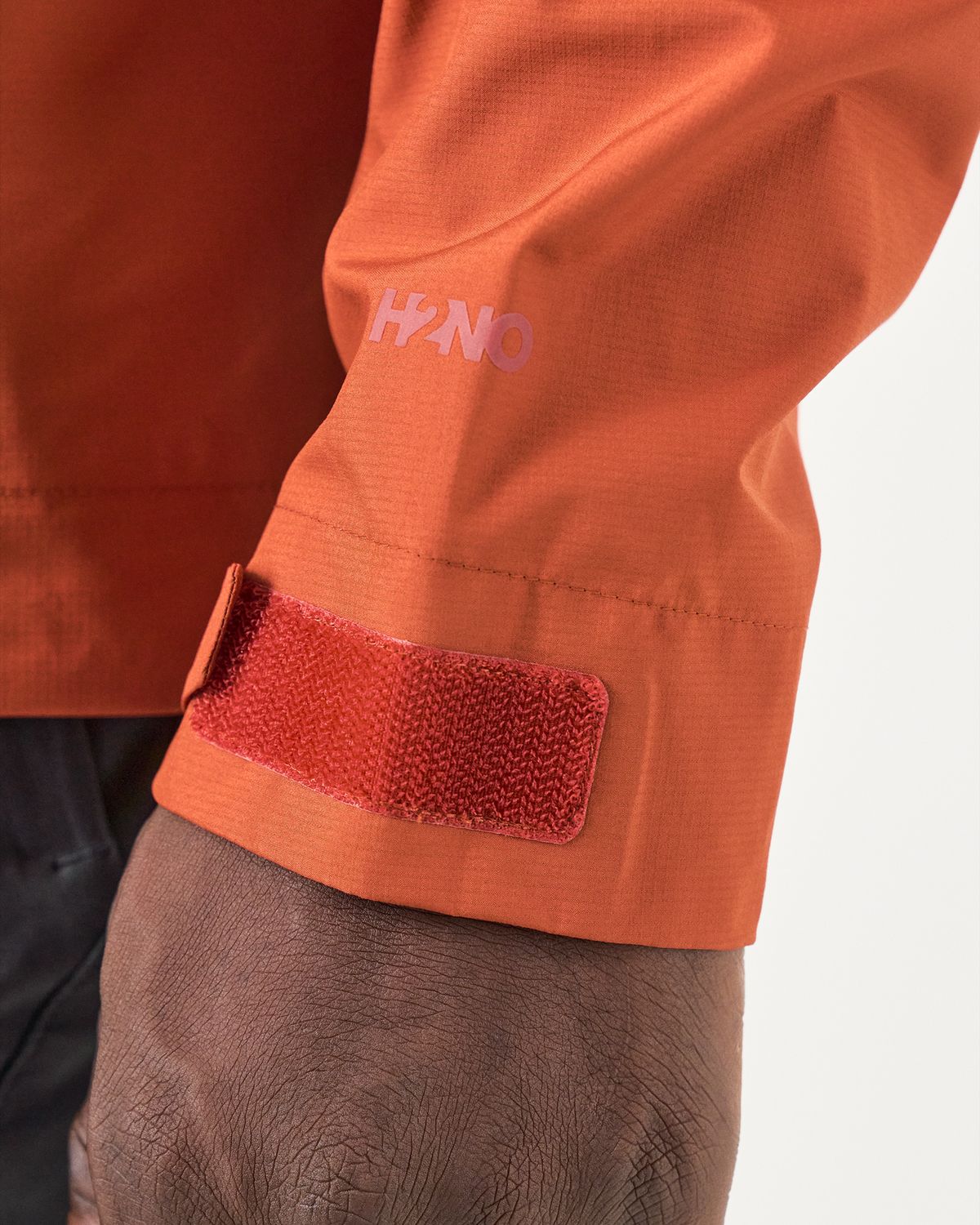 Hook-and-loop adjustable cuffs