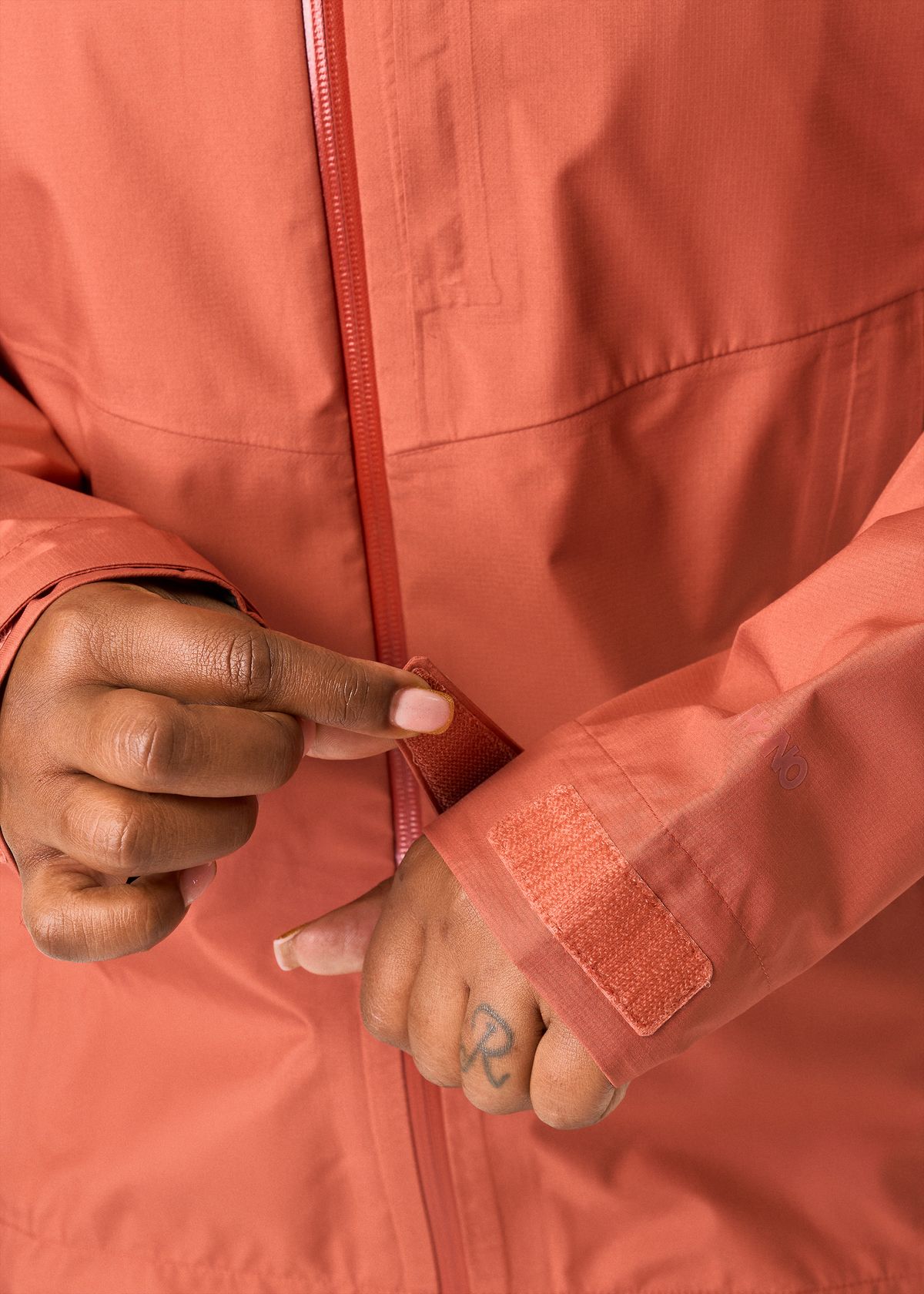 Hook-and-loop adjustable cuffs 