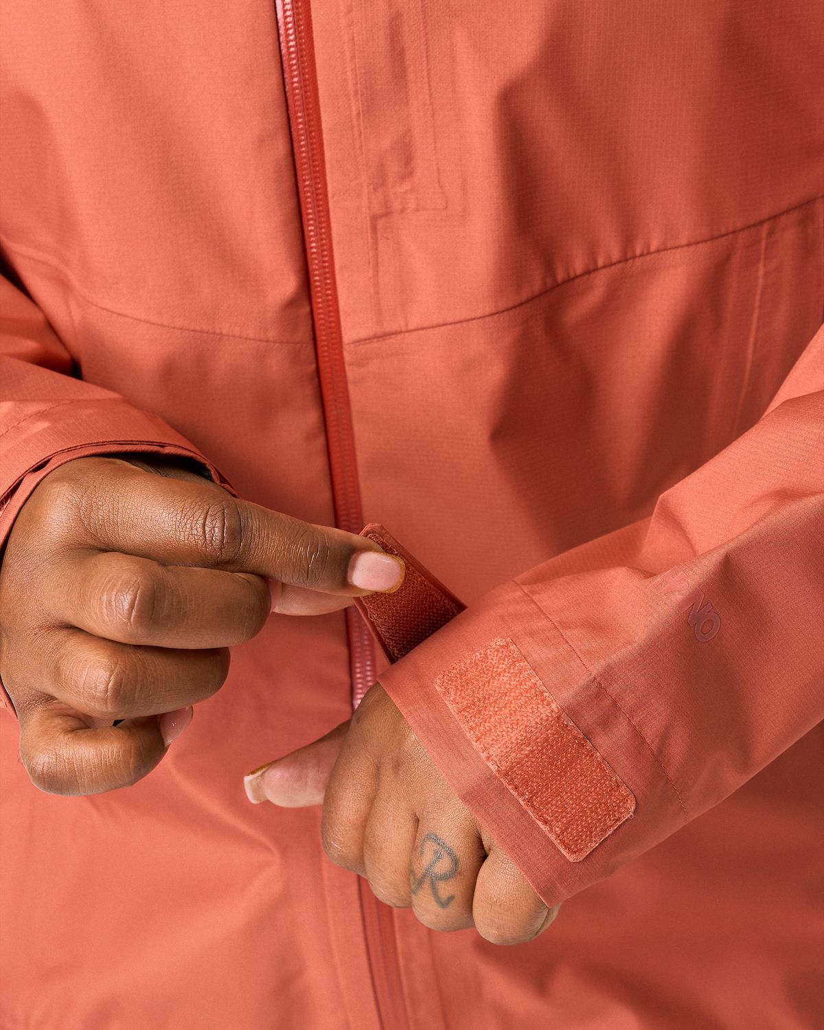 Hook-and-loop adjustable cuffs 