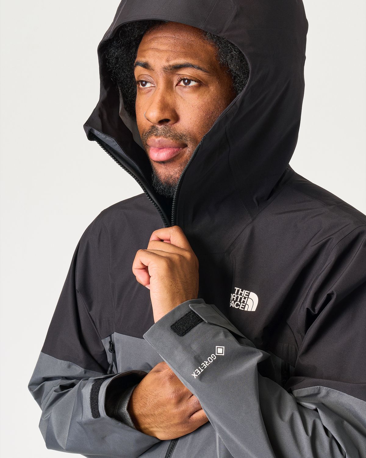 Adjustable helmet compatible hood