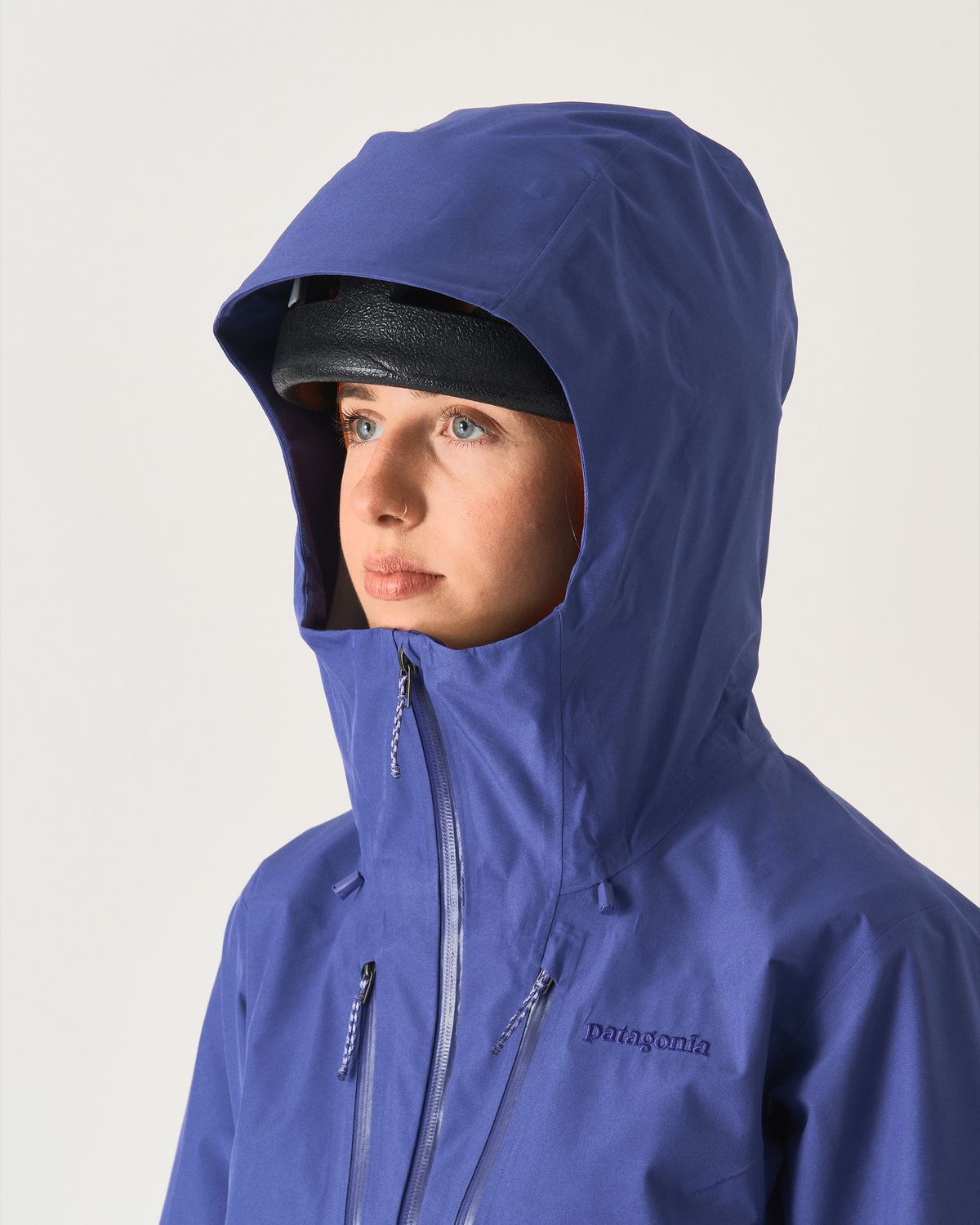 Adjustable helmet compatible hood