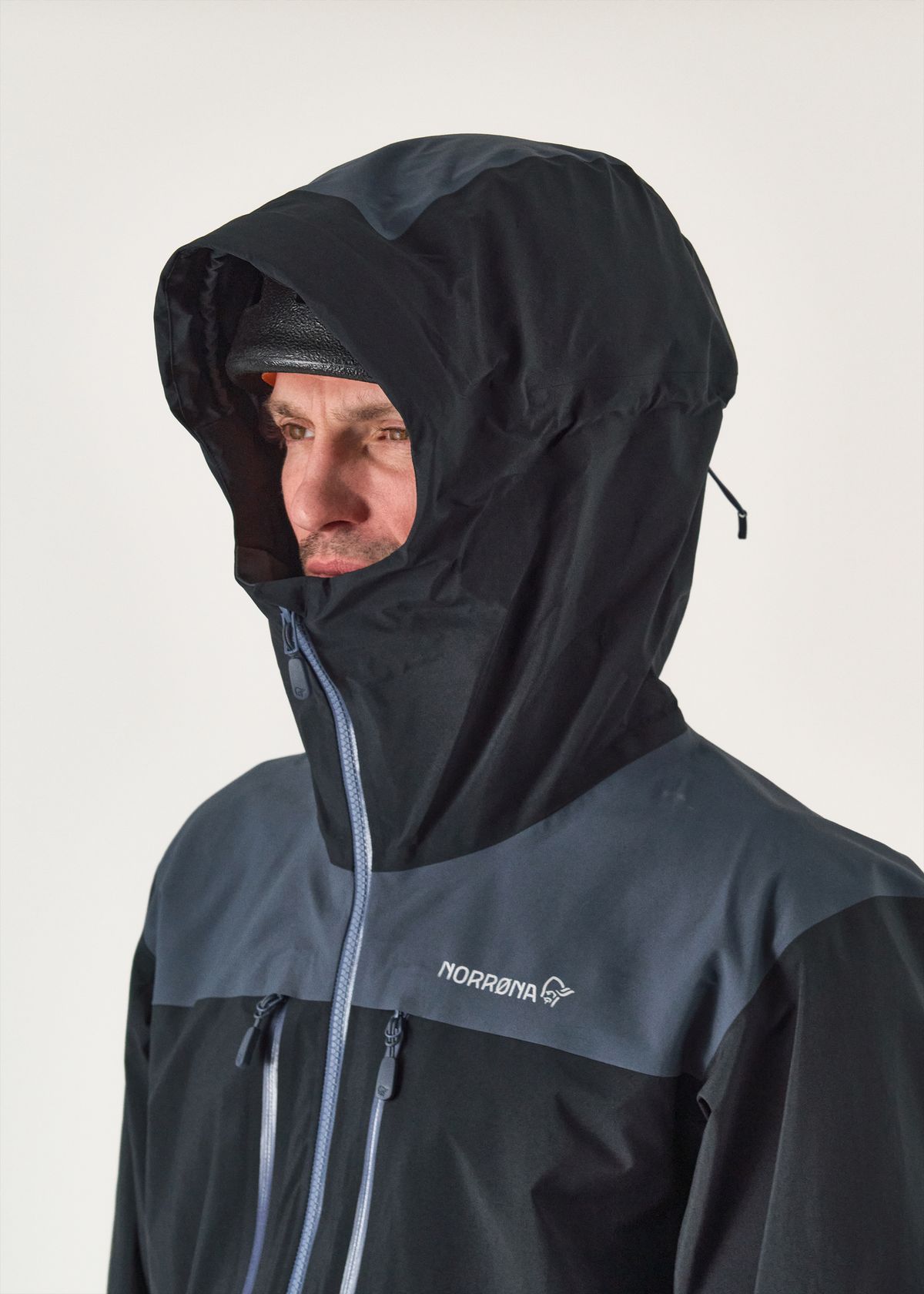 Adjustable helmet compatible hood    