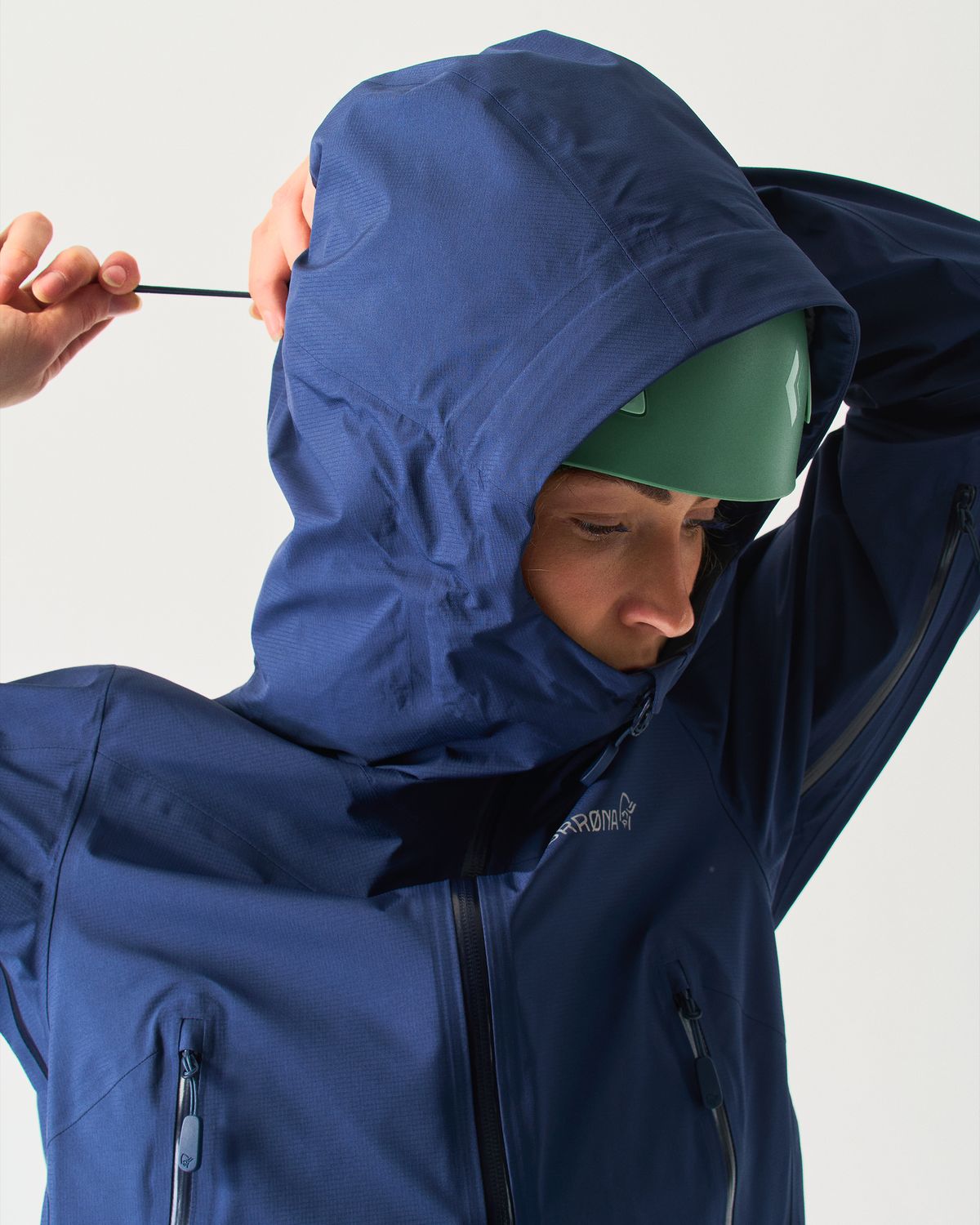 Adjustable helmet compatible hood