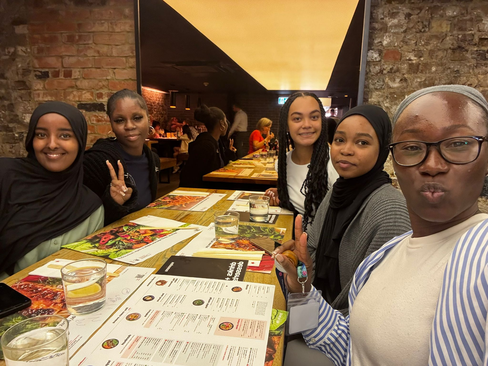 Interns from the Octopus in Colour 2025 internship have dinner together