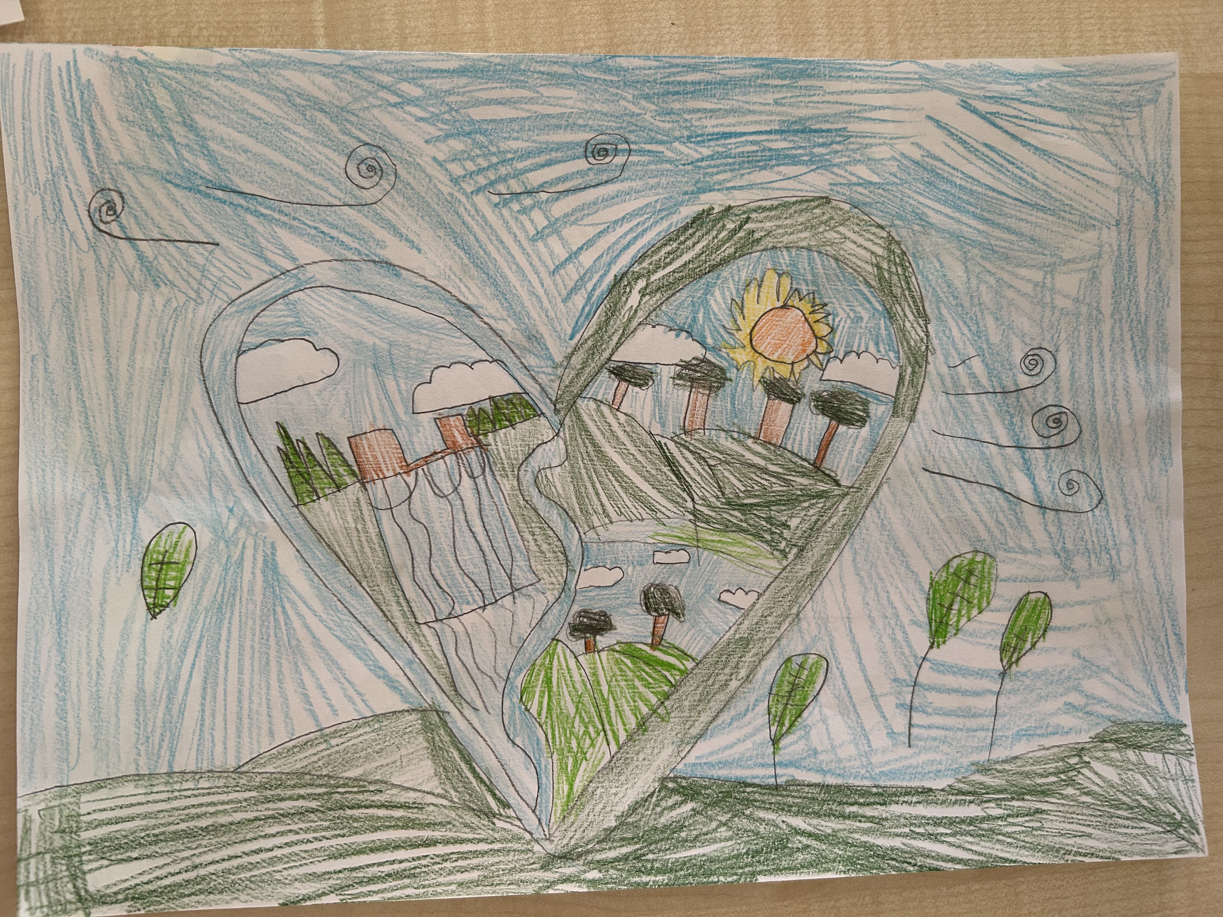 Child's drawing of a heart-shaped landscape with trees, a sun, hills, and swirling clouds against a blue sky.