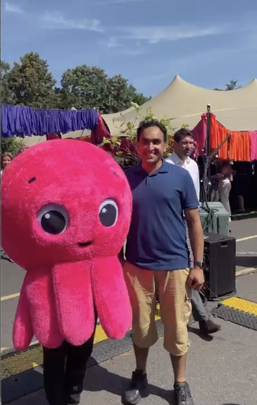 A customer with Constantine the octopus mascot
