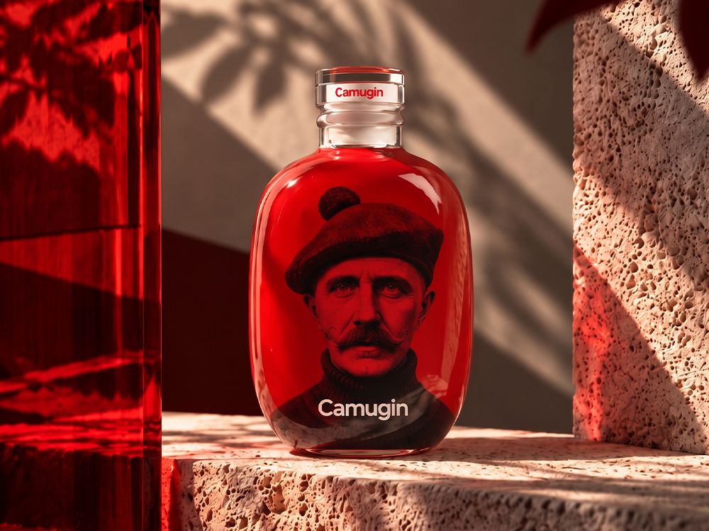 Stone bottle by Berlin Packaging for Camugin with red liquid, featuring an image of a man wearing a beret on the label, set against a textured surface.