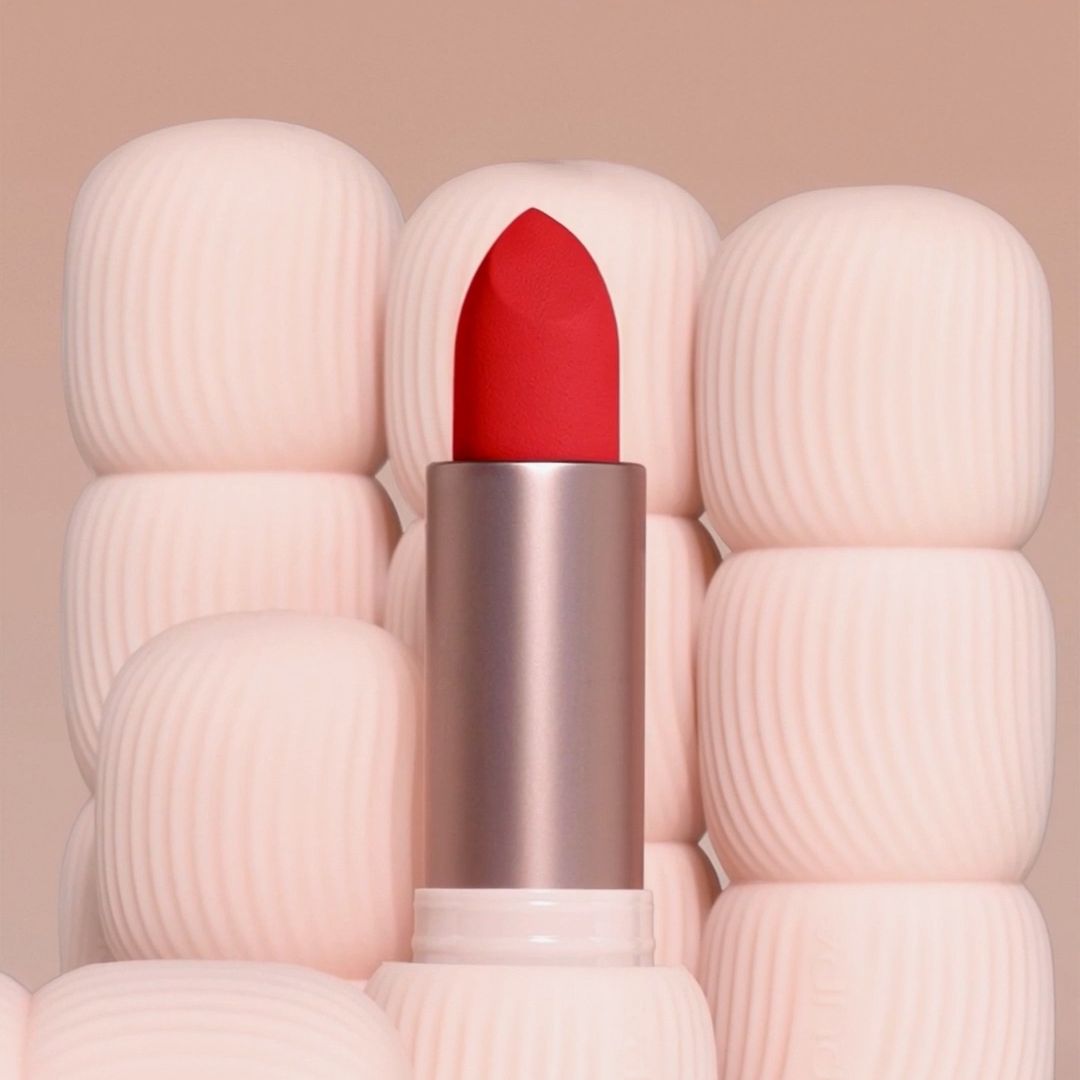 Pupa Milano My Crush lipstick with open red shade surrounded by multiple ribbed cosmetic cases, showcasing packaging design, color impact and modular beauty packaging elements.