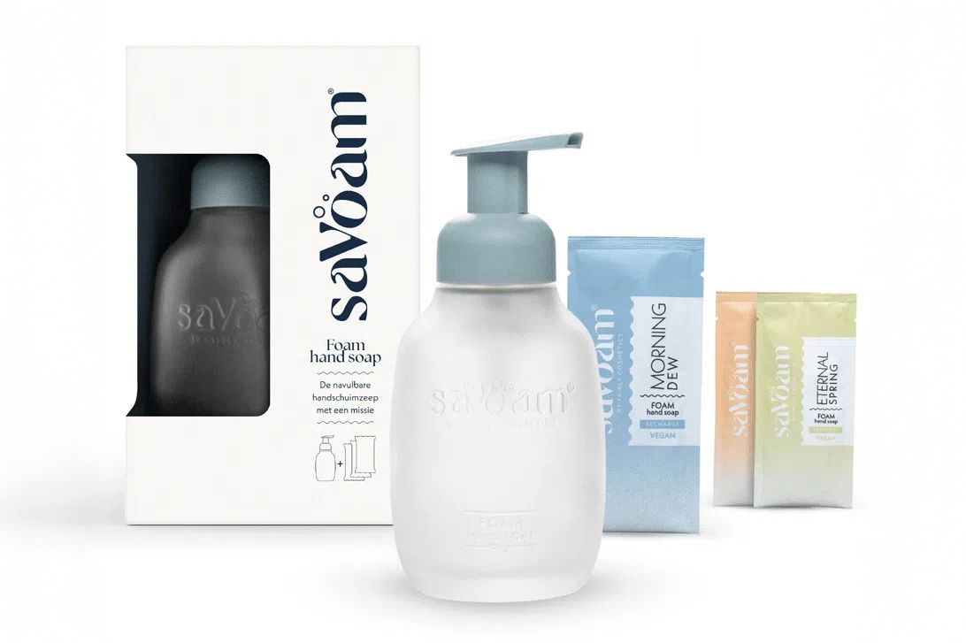 Set of Savδam foam hand soap, featuring a pump bottle and three refill packets in blue, yellow, and white, next to a branded box.
