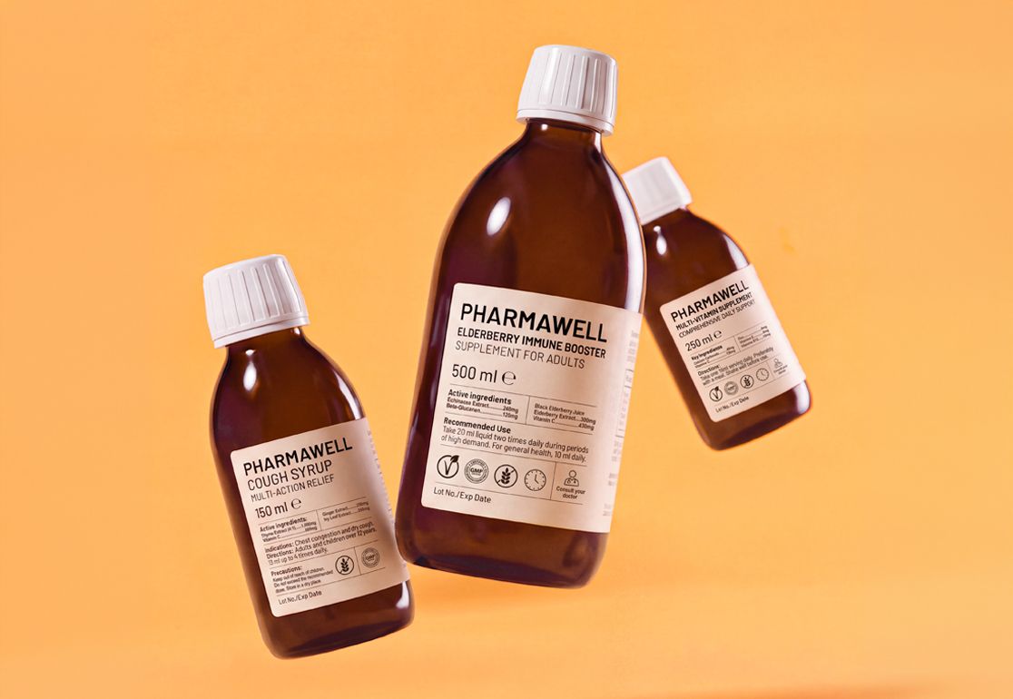 Three brown bottles of cough syrup and supplement, each with white caps and labels, set against an orange background.