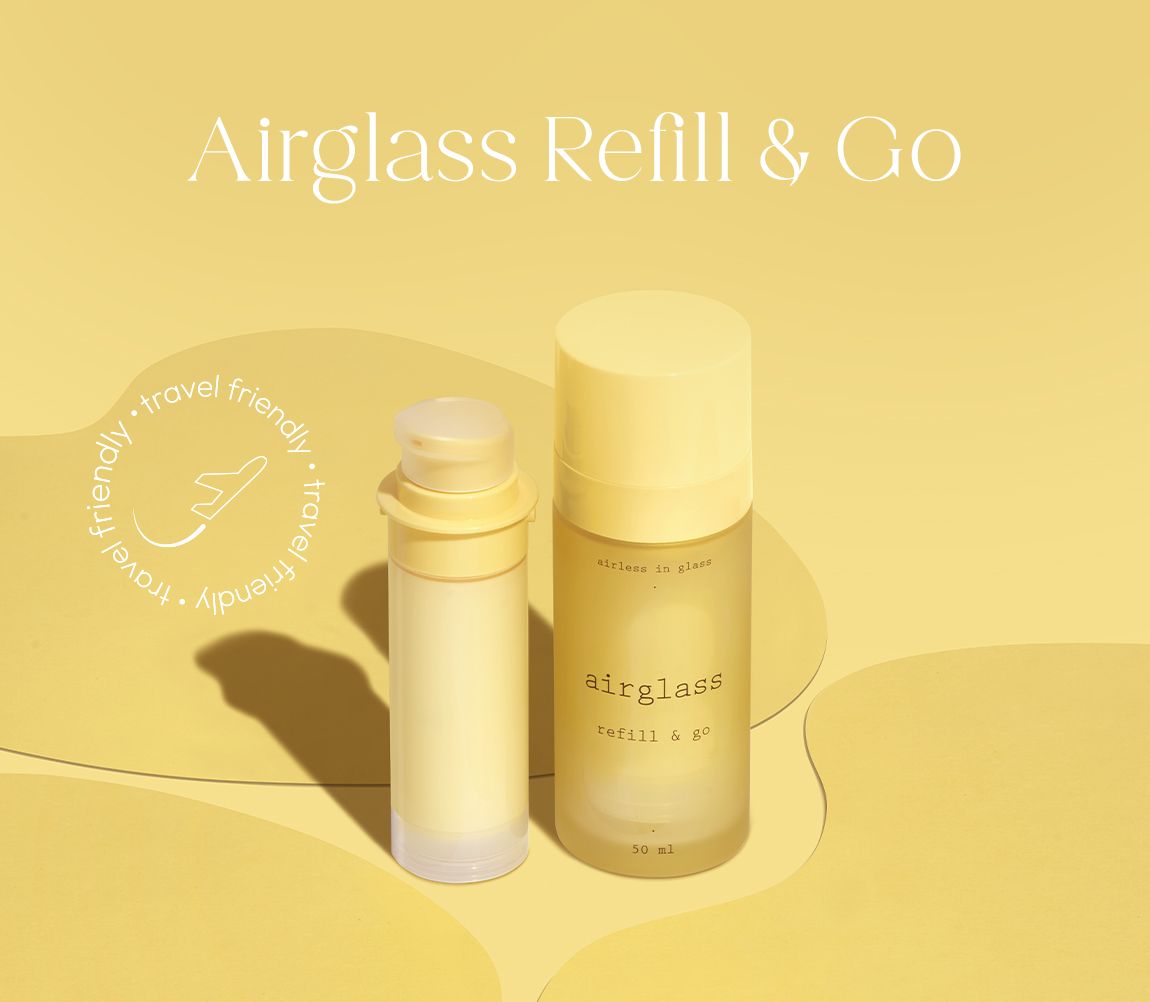 Airglass Refill & Go packaging in soft yellow, showing a 50 ml airless bottle with pump and a separate refill cartridge, labeled as travel-friendly.