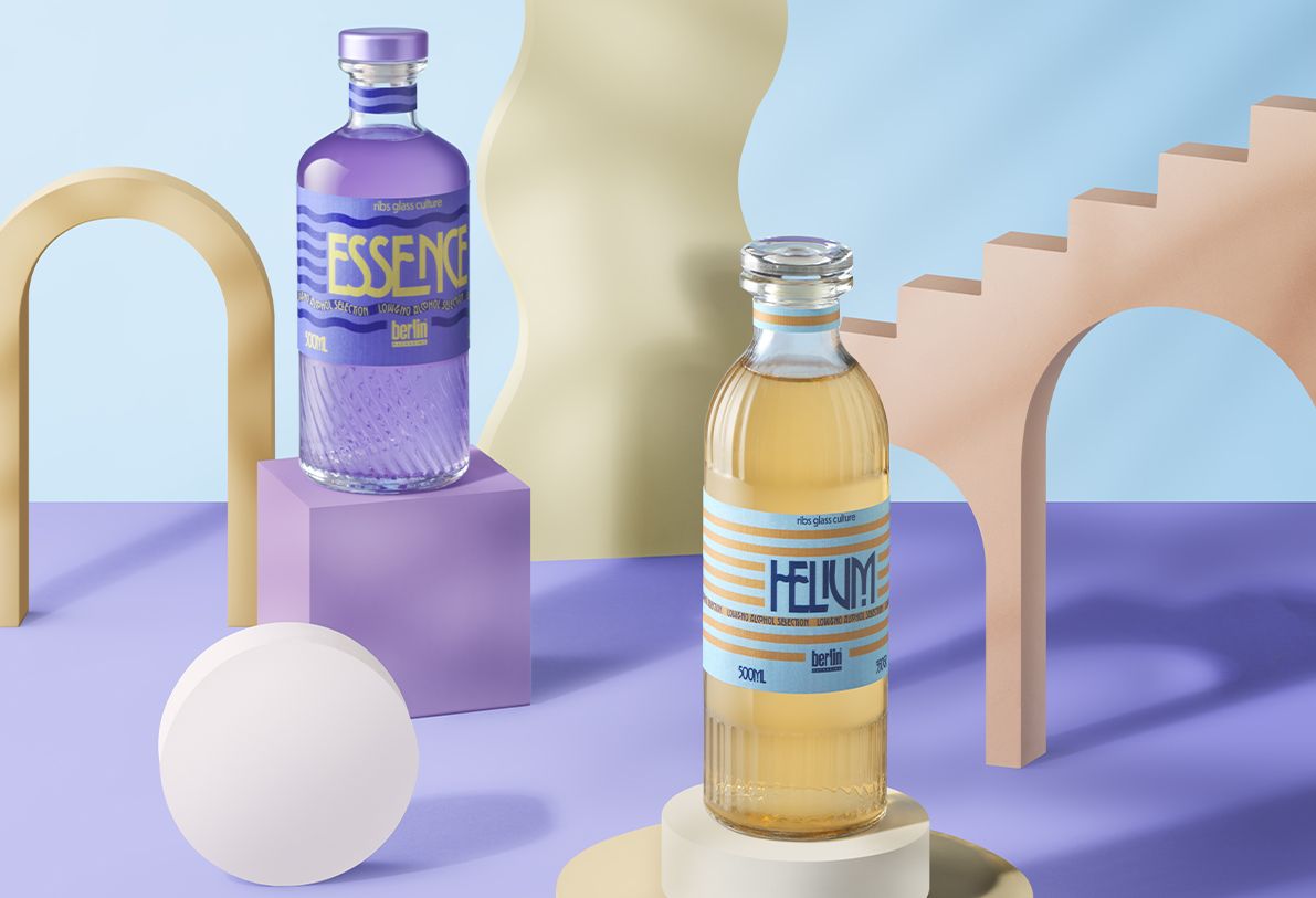 Two bottles from ribss glass collection by Berlin Packaging on display, Essence RIbs is purple liquid and Helium RIbs filled with amber liquid, with artistic, abstract backgrounds in pastel colors.