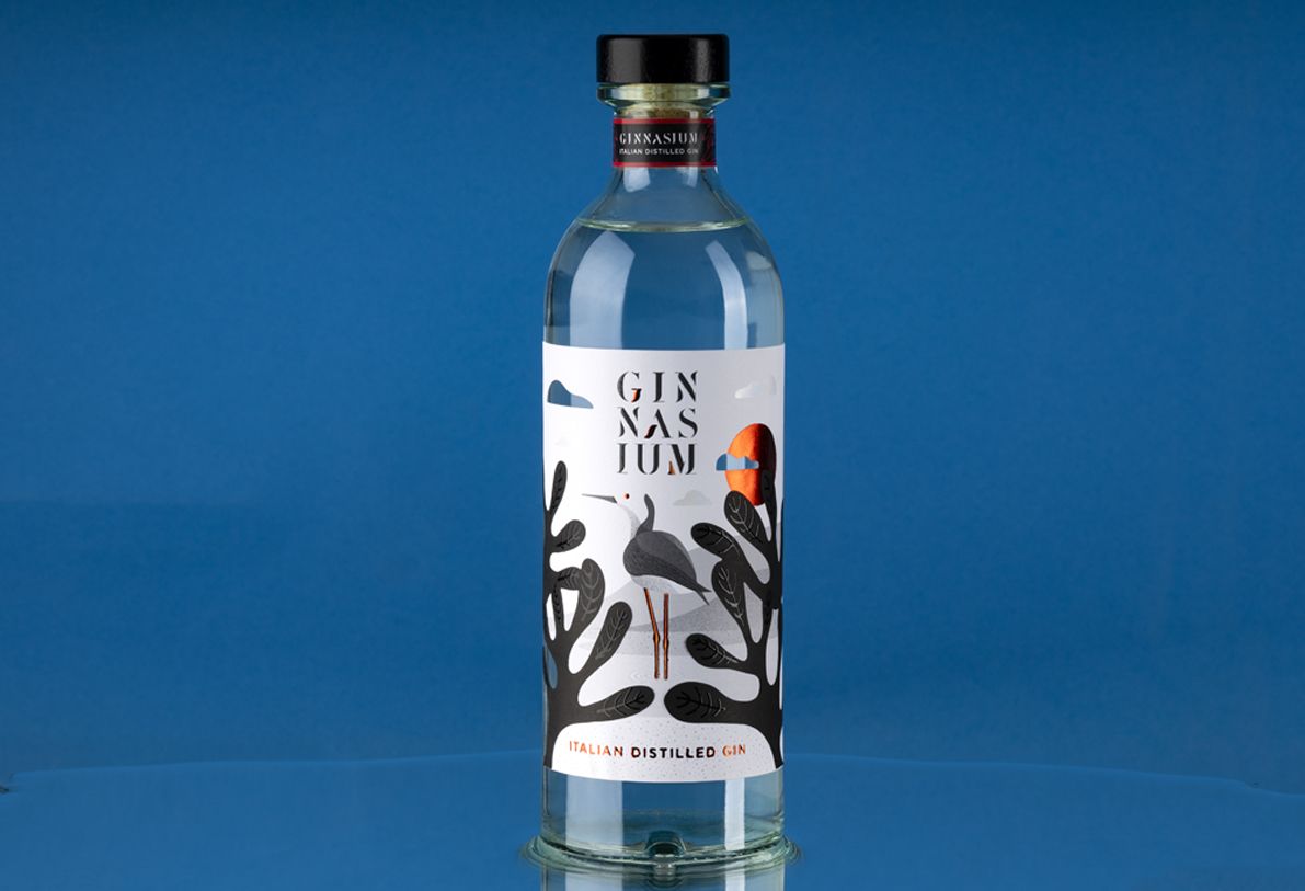 Helium Mixology 750 ml glass bottle for spirits by Berlin Packaging customized by Mark Design, featuring illustrated label with graphic elements and clean cylindrical shape for premium packaging within the Ginnasium project.