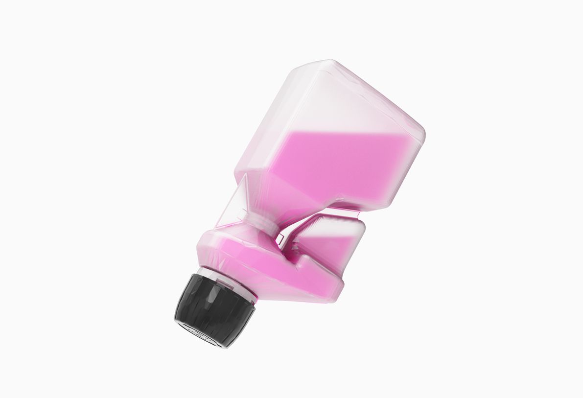 News_Dosing_bottle2 Pink liquid in a clear, uniquely shaped bottle with a black cap, tilted against a white background.