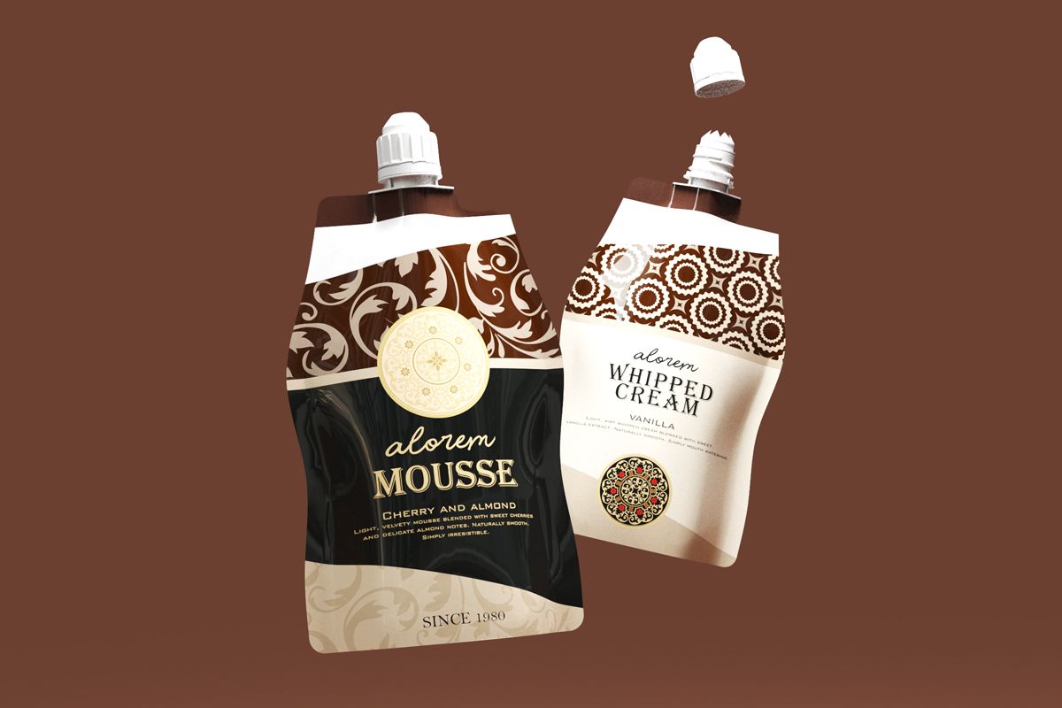 Two premium spout pouches for dessert garnishes displayed on a brown background. One pouch is labeled “Alorem Mousse – Cherry and Almond” in black and gold design, and the other is labeled “Alorem Whipped Cream – Vanilla” in cream and brown design, both featuring decorative patterns and white caps. Two premium spout pouches for dessert garnishes displayed on a brown background. One pouch is labeled “Alorem Mousse – Cherry and Almond” in black and gold design, and the other is labeled “Alorem Whipped Cream – Vanilla” in cream and brown design, both featuring decorative patterns and white caps.