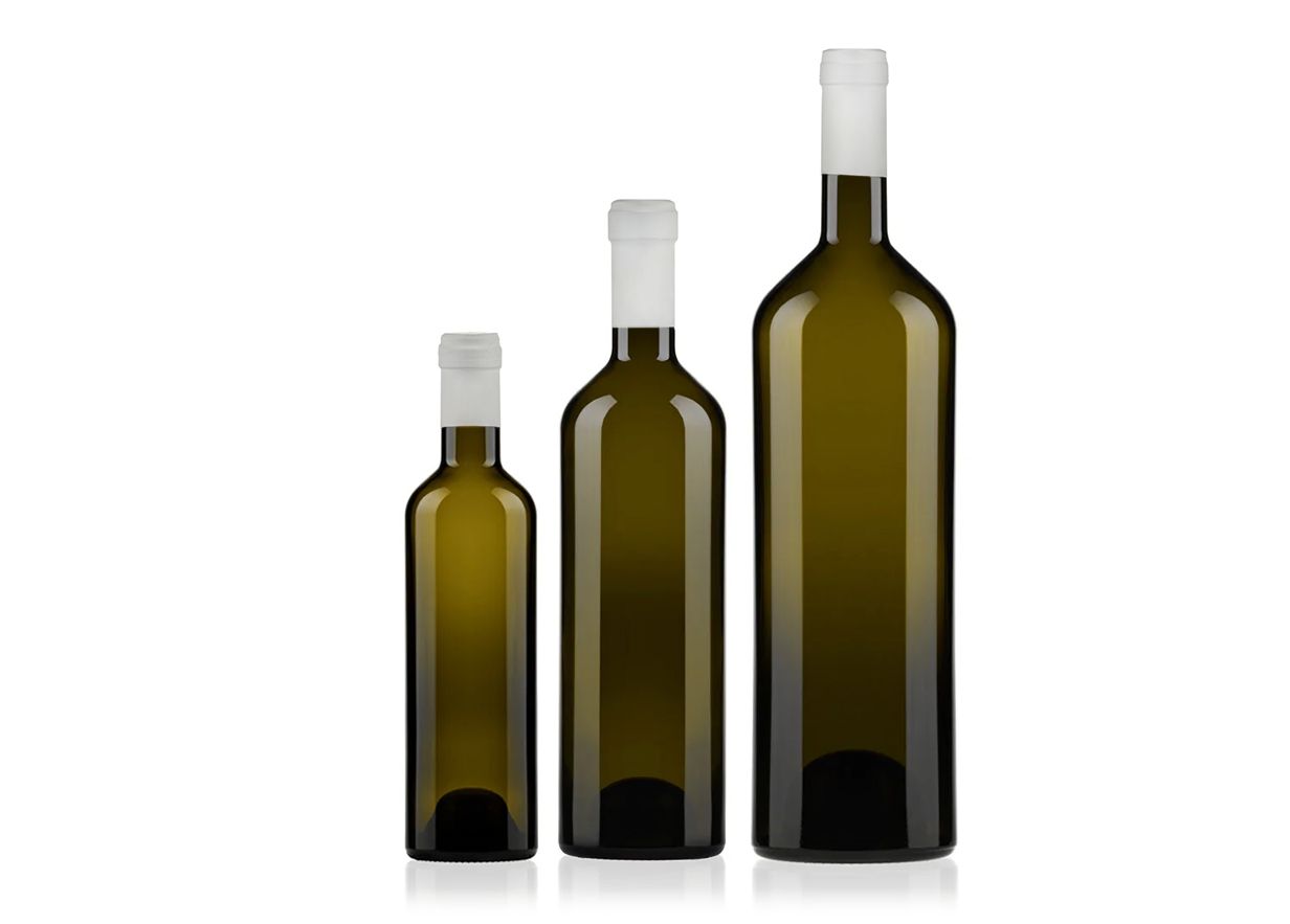 Three Cassia Evo bottles by berlin packagin of varying sizes with white caps, arranged in ascending order.