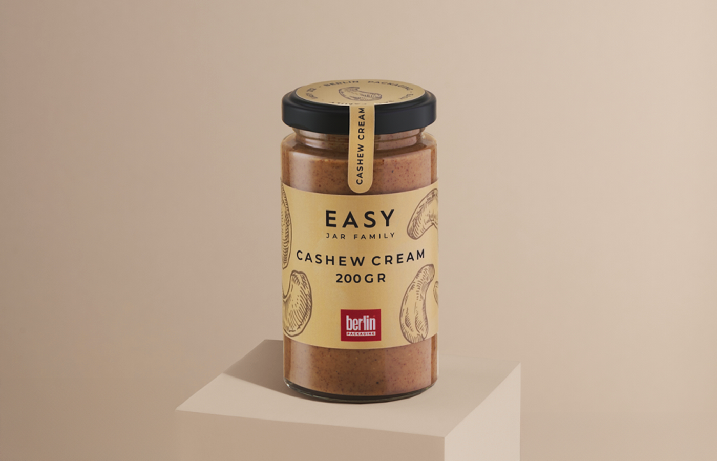Glass jar of cashew cream from the Easy Jar Family collection, 200 grams, with a beige label showing cashew illustrations and the Berlin Packaging logo.