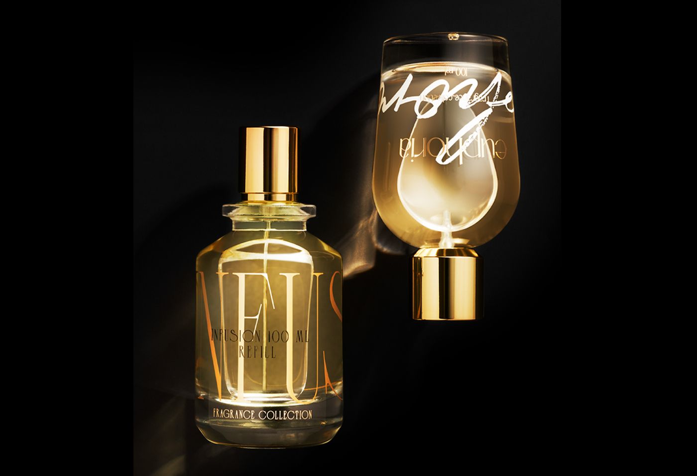 bp_em_news_clichè-&-touchè-cover Transparent fragrance bottles Infusion and Euphoria with gold hot stamping and screen printing, paired with Berlin Packaging’s Cliché and Touché caps in a luxurious gold finish, paired with Clichè & Touchè fragrance accessories and displayed on a black background with elegant light reflections.