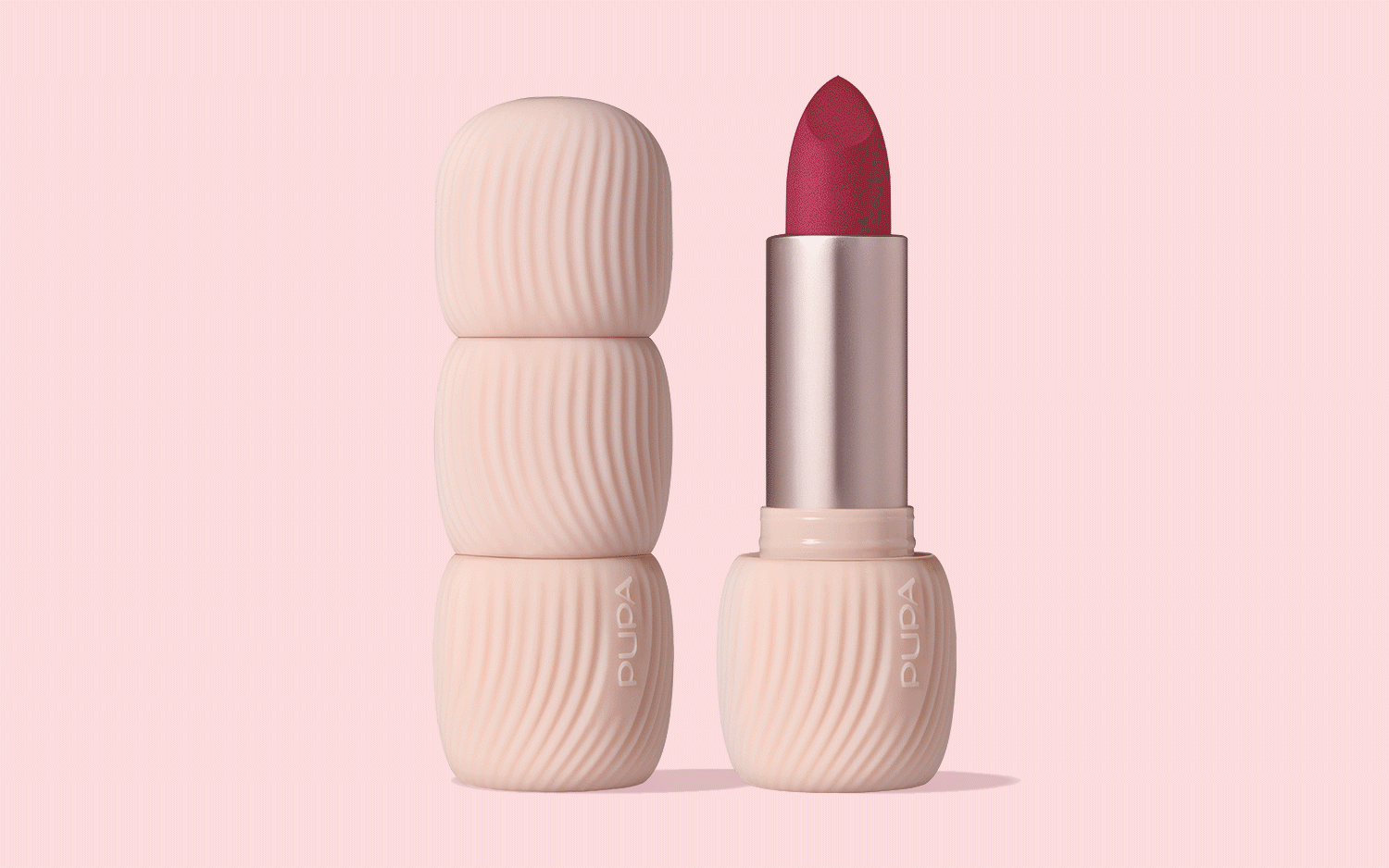 Pupa Milano My Crush lipstick packaging featuring textured cosmetic case and open lipstick in red shade on pink background, showcasing beauty packaging design and color variations.