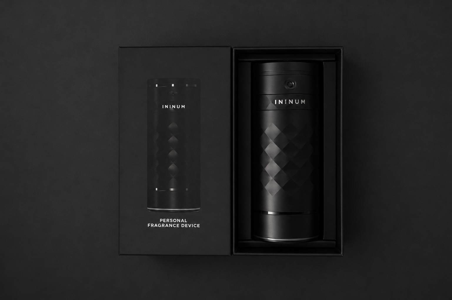 Ininum personal fragrance device by Berlin Packaging Beauty displayed in premium secondary packaging, featuring a faceted black design and smart fragrance technology for personalized scent experiences through interchangeable refill cartridges.
