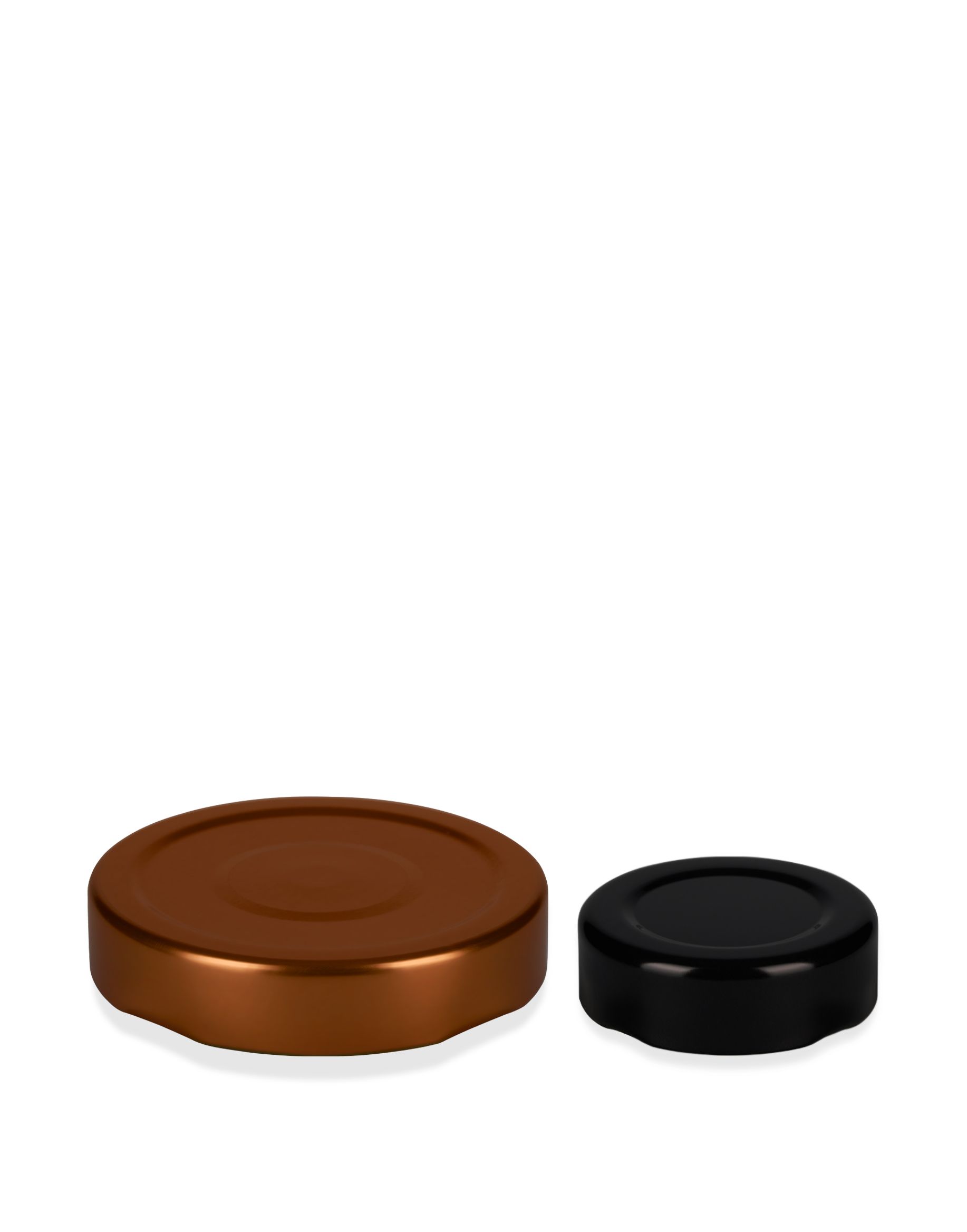 Two round, flat metal lids on a white background; one is copper-colored and the other is black.