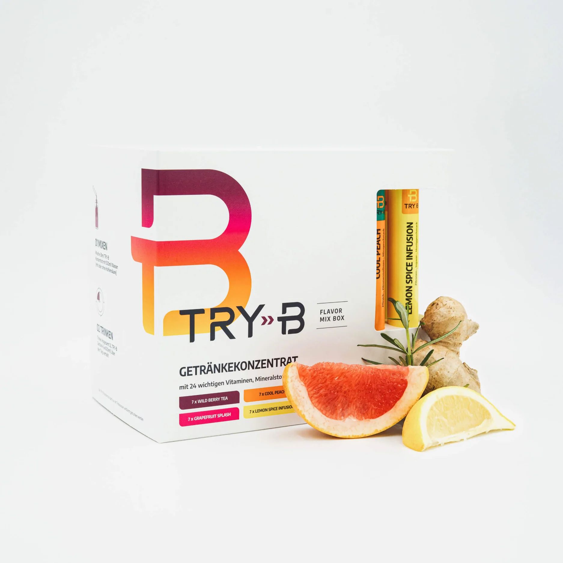TRY B beverage concentrate mix box with grapefruit, lemon, ginger, and rosemary arranged in front, along with two flavor sticks partially visible