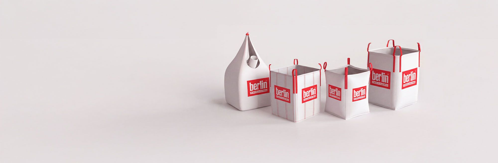 Four white containers with red handles and "Berlin Packaging" logo, varying in size from narrow to wide, on a light background.