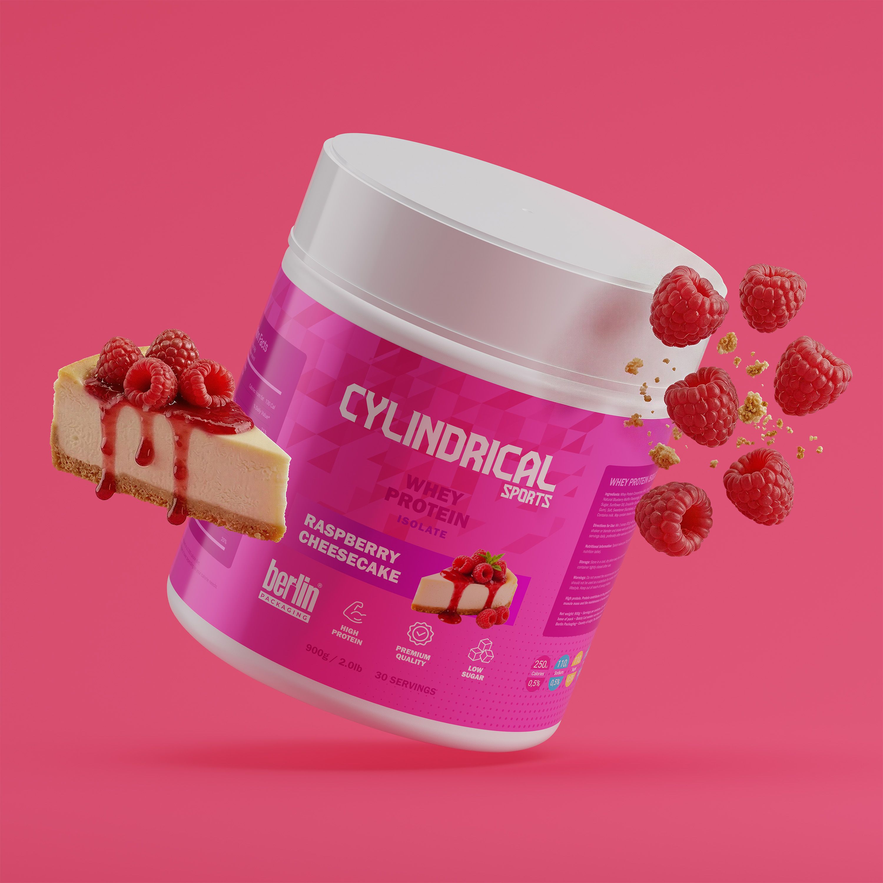 Cylindrical whey protein tub in Raspberry Cheesecake flavor floating on a pink background, with fresh raspberries and a slice of cheesecake splashing with raspberry sauce.
