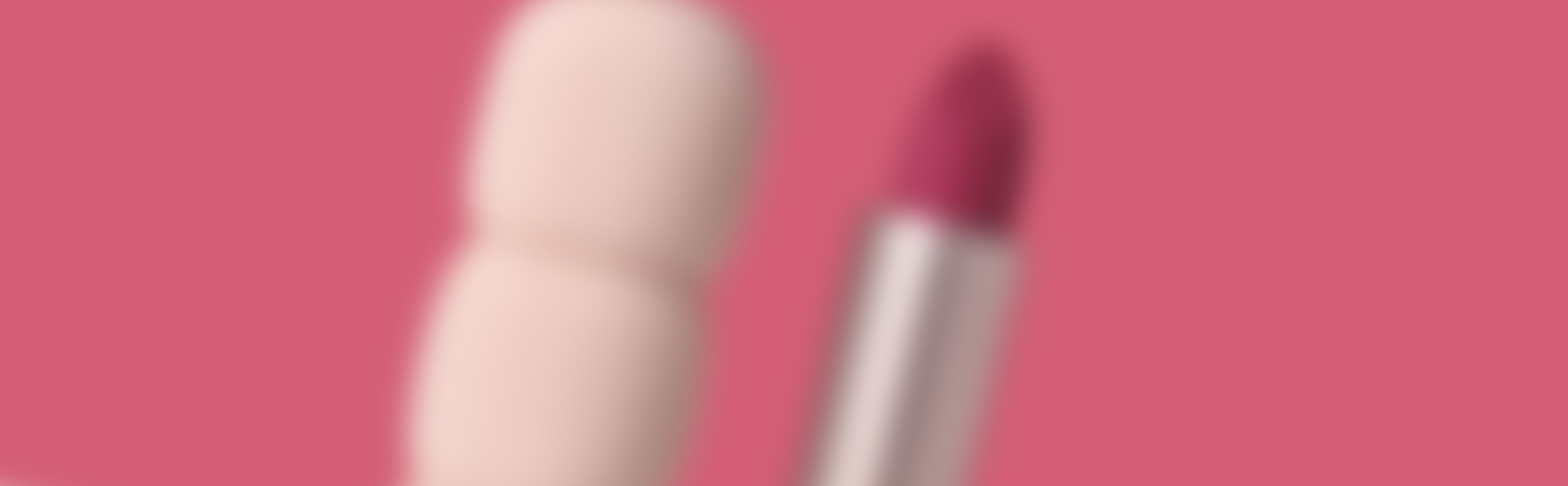 Pupa Milano My Crush lipstick banner featuring blurred open lipstick with red bullet and matching packaging silhouette on pink background, highlighting cosmetic packaging design and beauty product innovation.