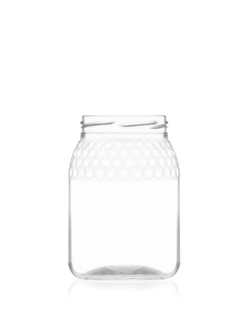 A clear jar with a honeycomb texture on the upper part, standing against a white background.