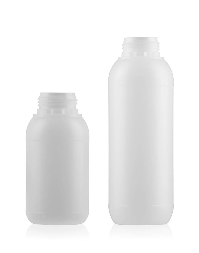 other_plastic_bottles Two white plastic bottles, one smaller and one larger, standing on a white surface against a plain background.