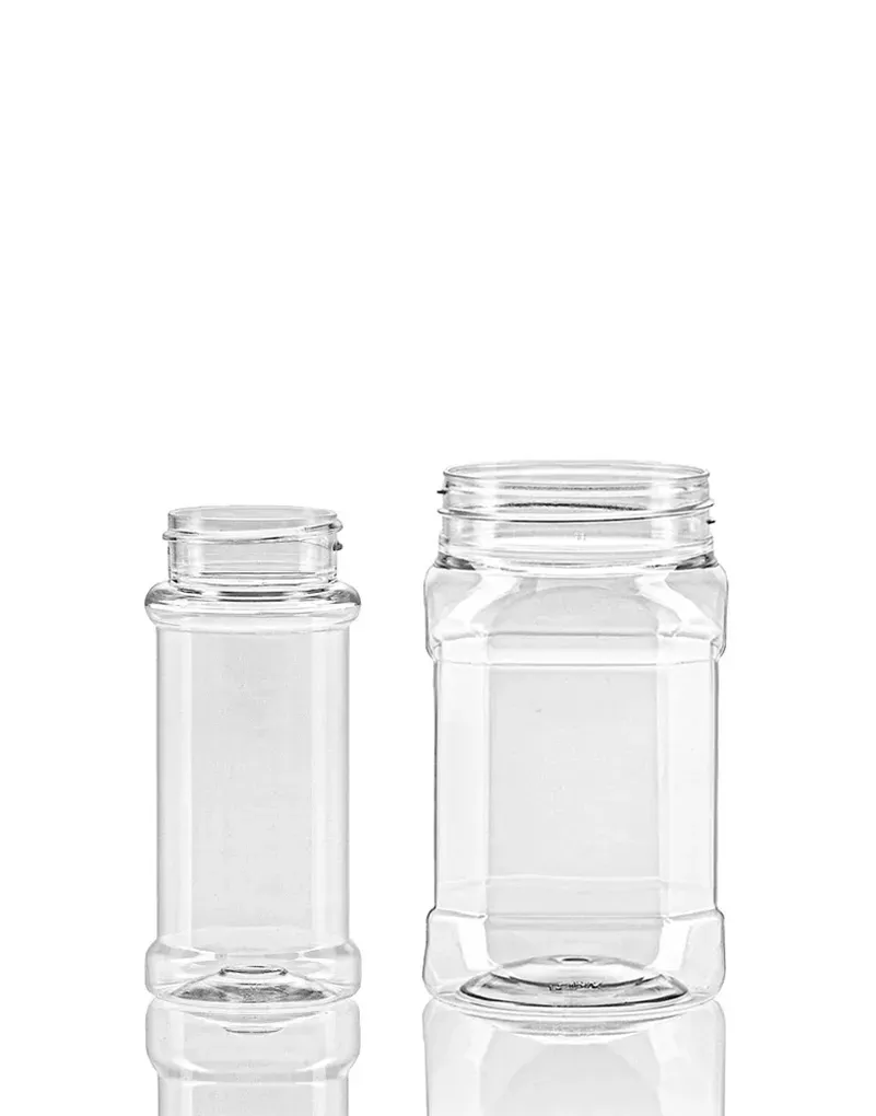 Two clear, empty glass jars of different sizes, placed side by side against a white background.