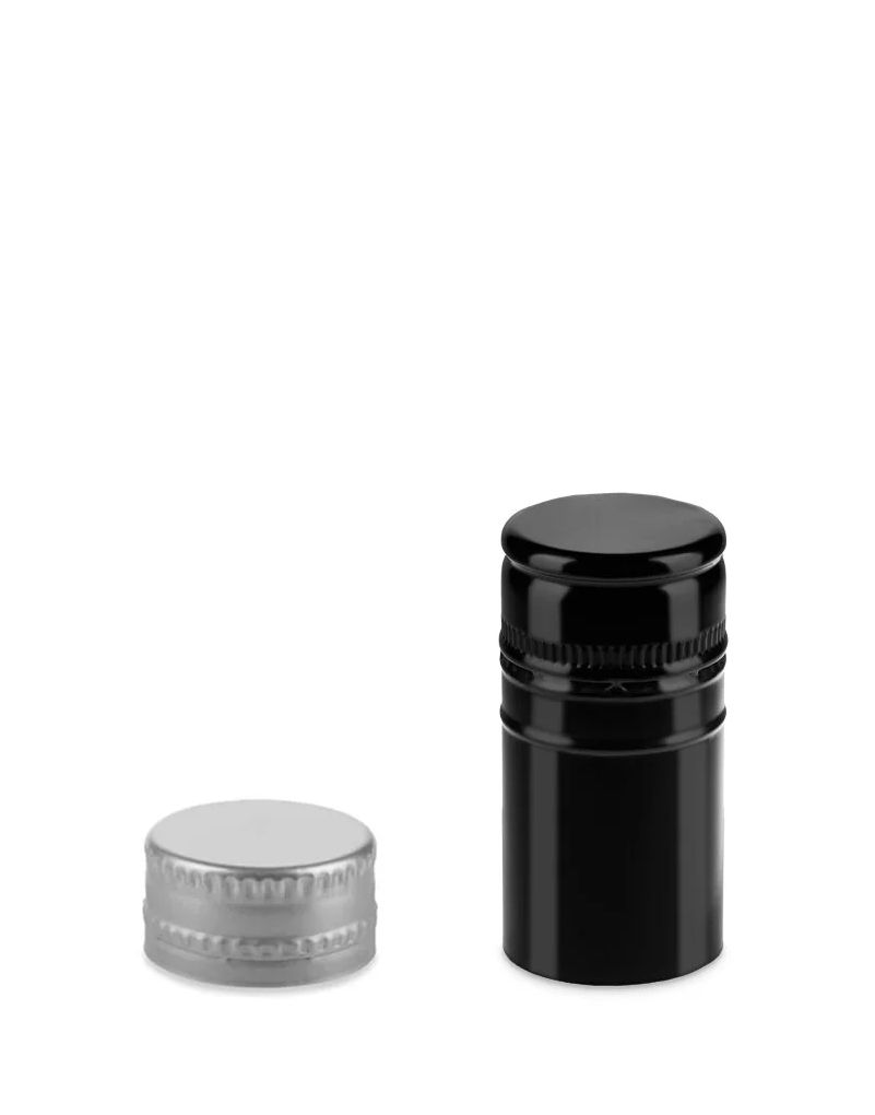 Two bottle caps on a white background; one metallic, one black plastic with a ribbed design.
