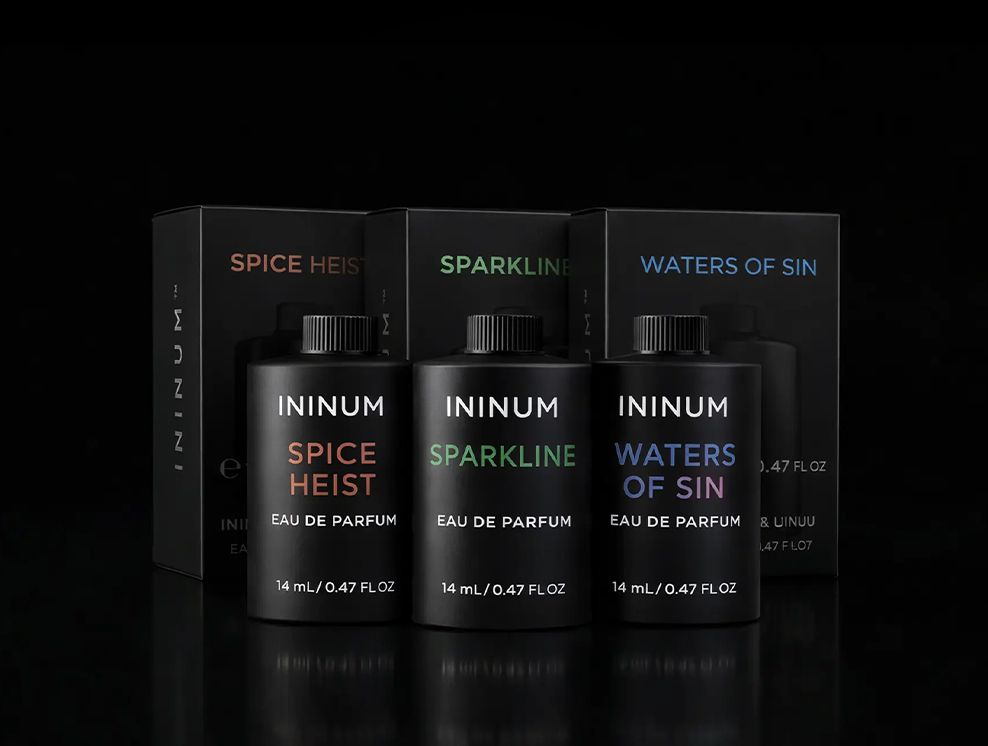 Ininum refill cartridges by Berlin Packaging Beauty displayed with matching fragrance boxes, featuring Spice Heist, Sparkline and Waters of Sin eau de parfum refills designed to provide multiple fragrance options within the Ininum smart fragrance system.